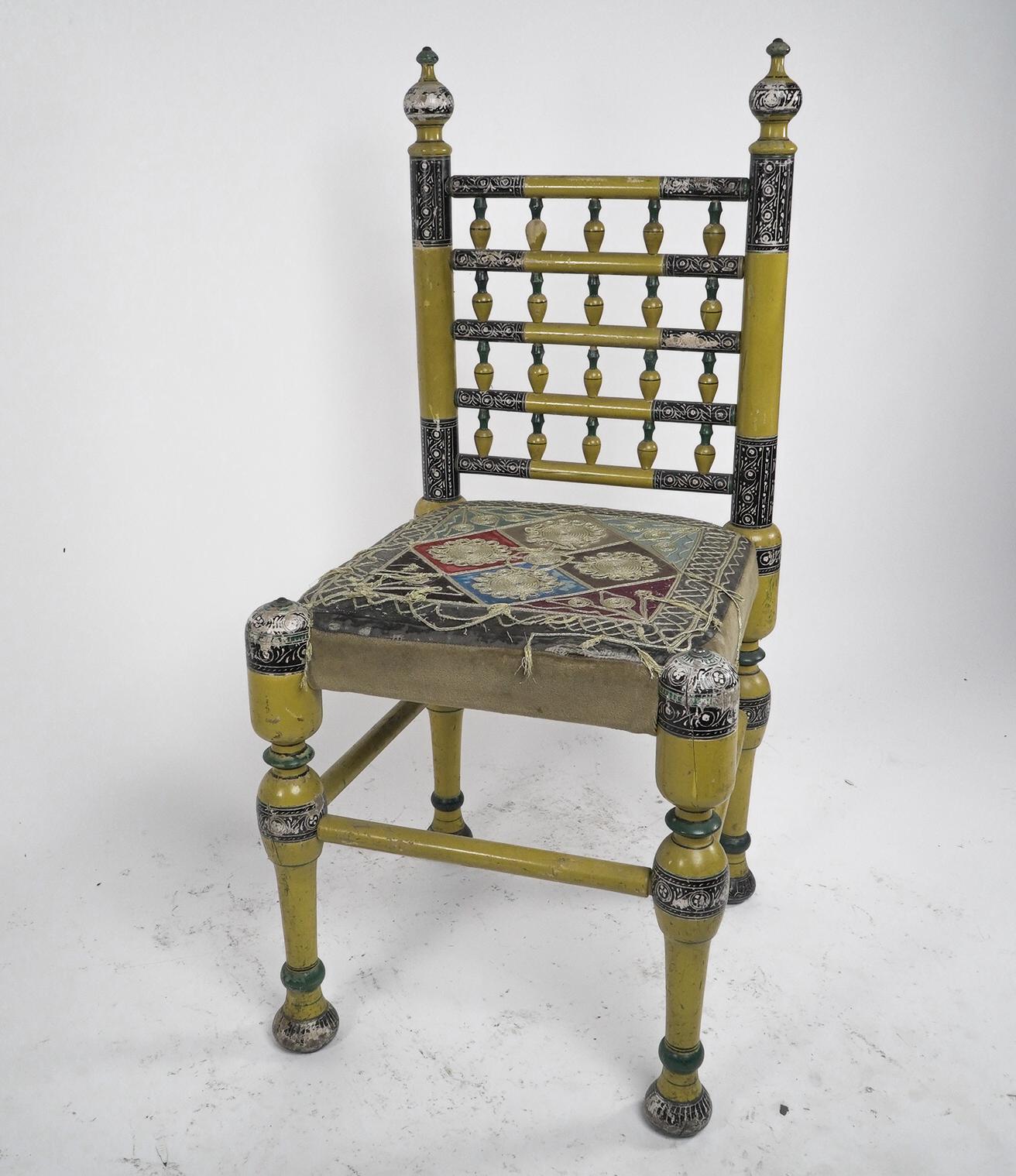 Painted Indian Rajasthani A pair of polychrome painted chairs with gilt chord embroidery For Sale