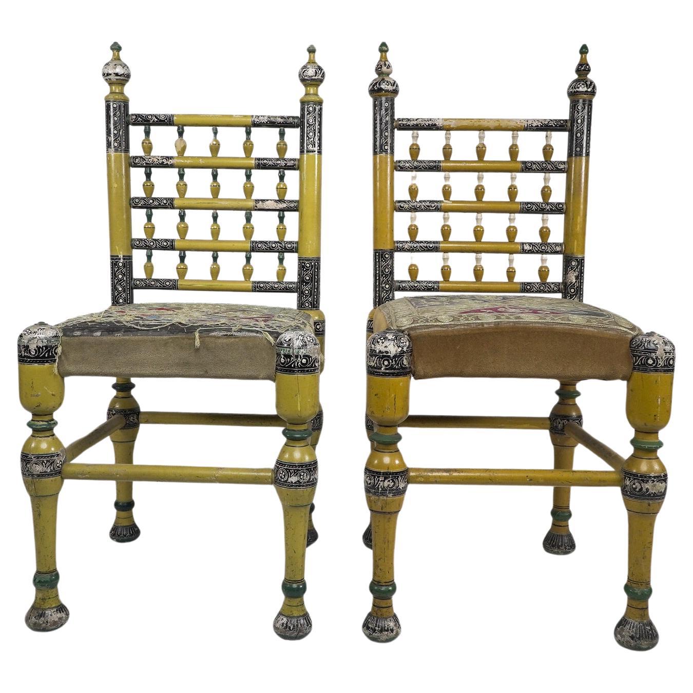 Indian Rajasthani. A rare pair of period side chairs finely painted in polychrome colours with the original floral gilt chord embroidery seats, the seats a little worn with minor losses to the paint. Price for the pair.
