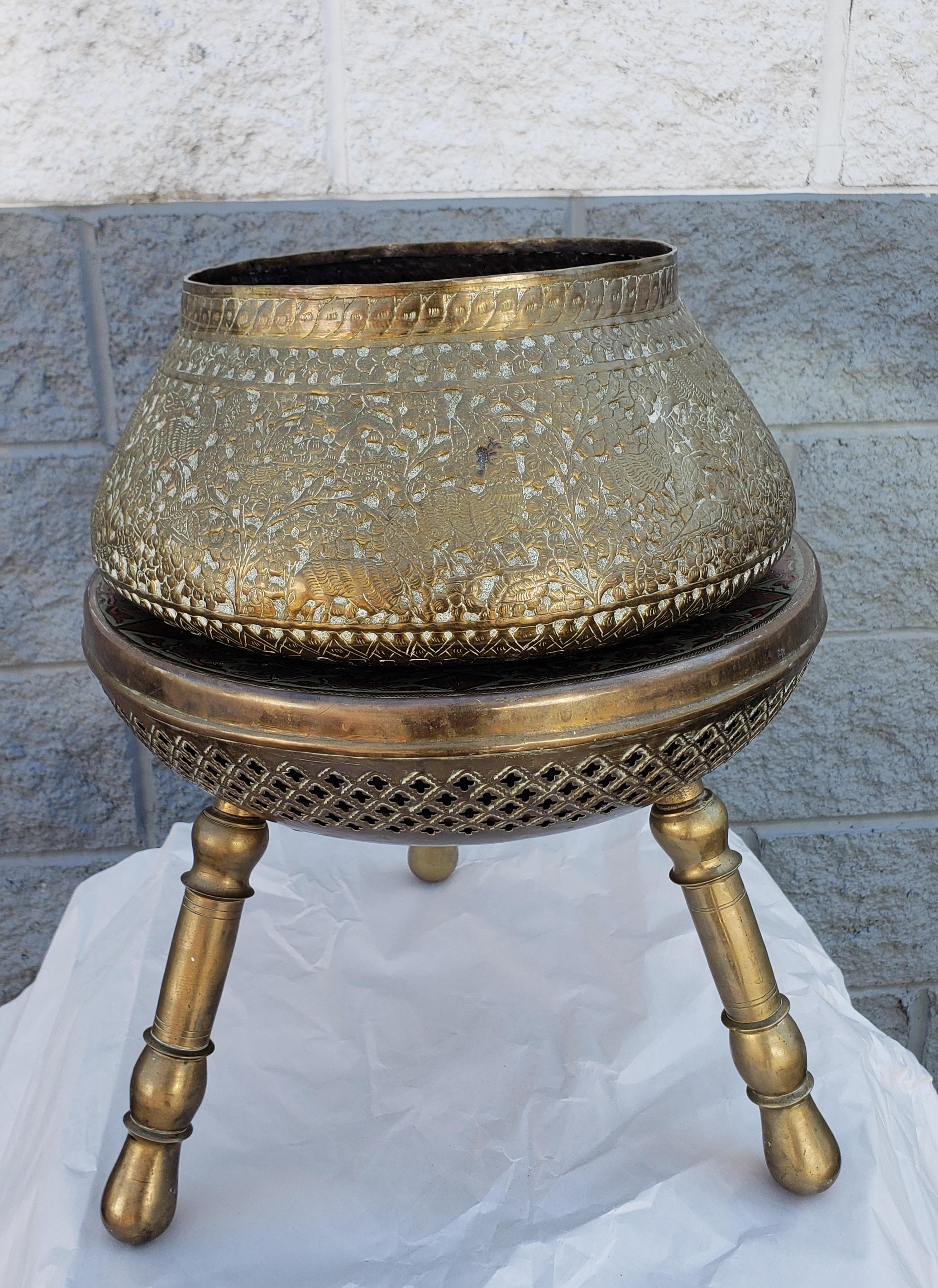 Indian Repoussé & engraved brass bowl / planter on engraved brass stand / stool. Large antique Anglo- Indian brass bowl or planter with amazing, very detailed engravings and Repoussés. Profusely chased with vines and vegetal motifs, detailed human,