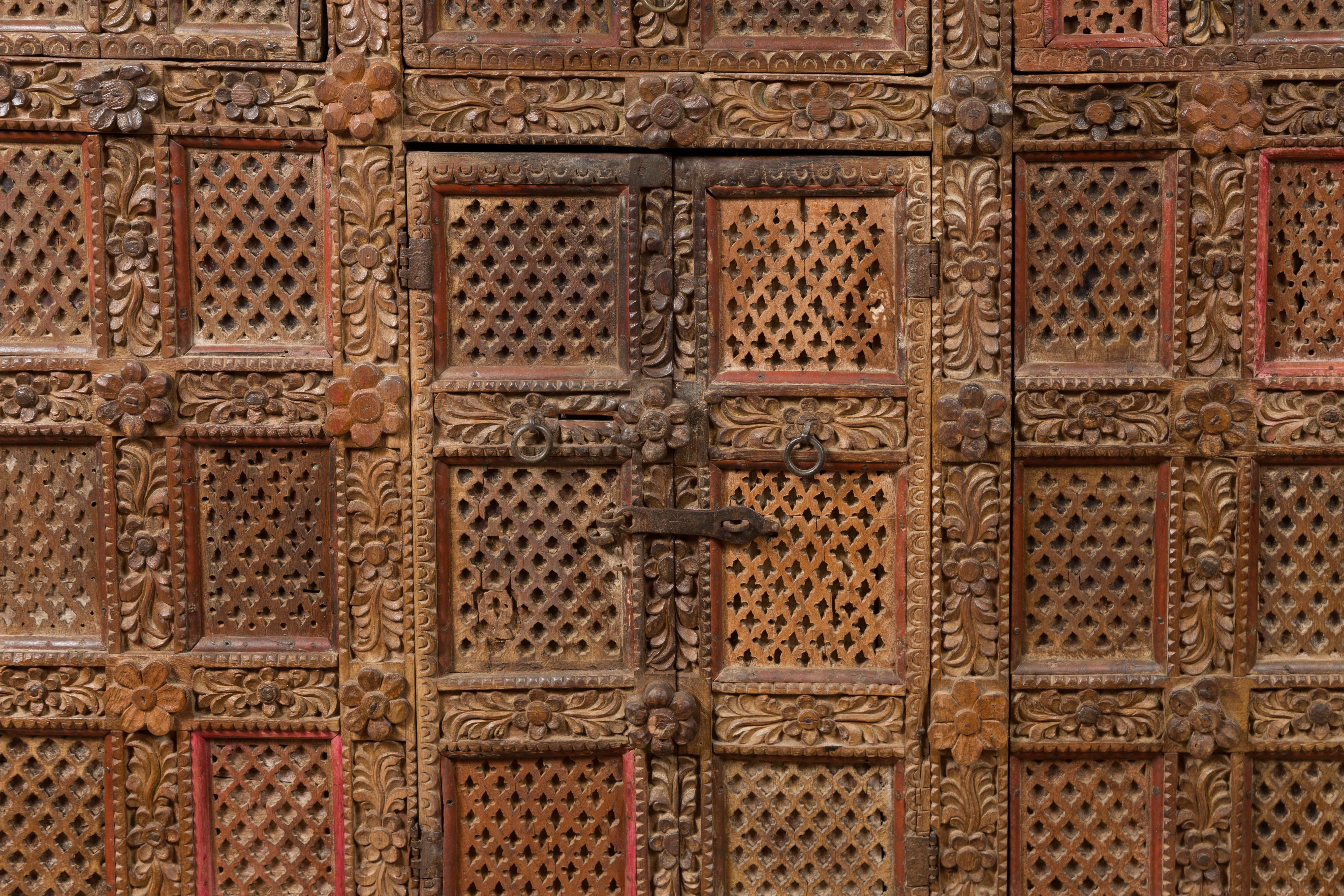 Indian Rubbed Wood Palace Cabinet with Carved Floral Decor and Red Patina 4