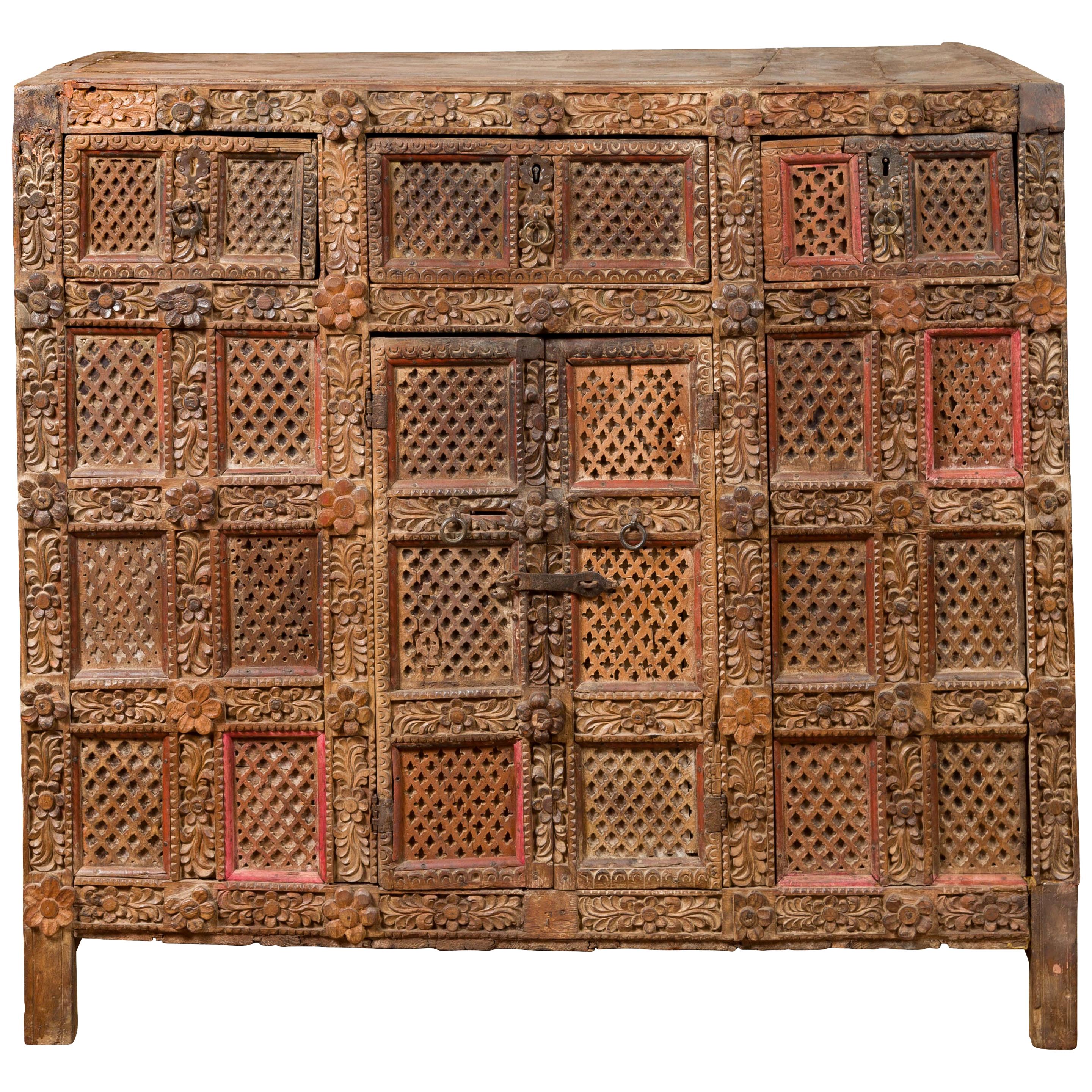 Indian Rubbed Wood Palace Cabinet with Carved Floral Decor and Red Patina