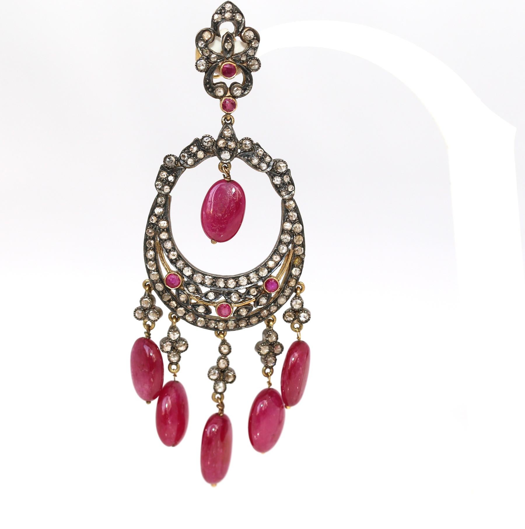 Chandelier Earrings with Indian Rubies Old-cut Diamonds Gold Silver. Bright red to purple stones look great and shiny, attracting attention in any circumstances. 

Fine earrings from the period of time when the whole world turned to Indian culture -