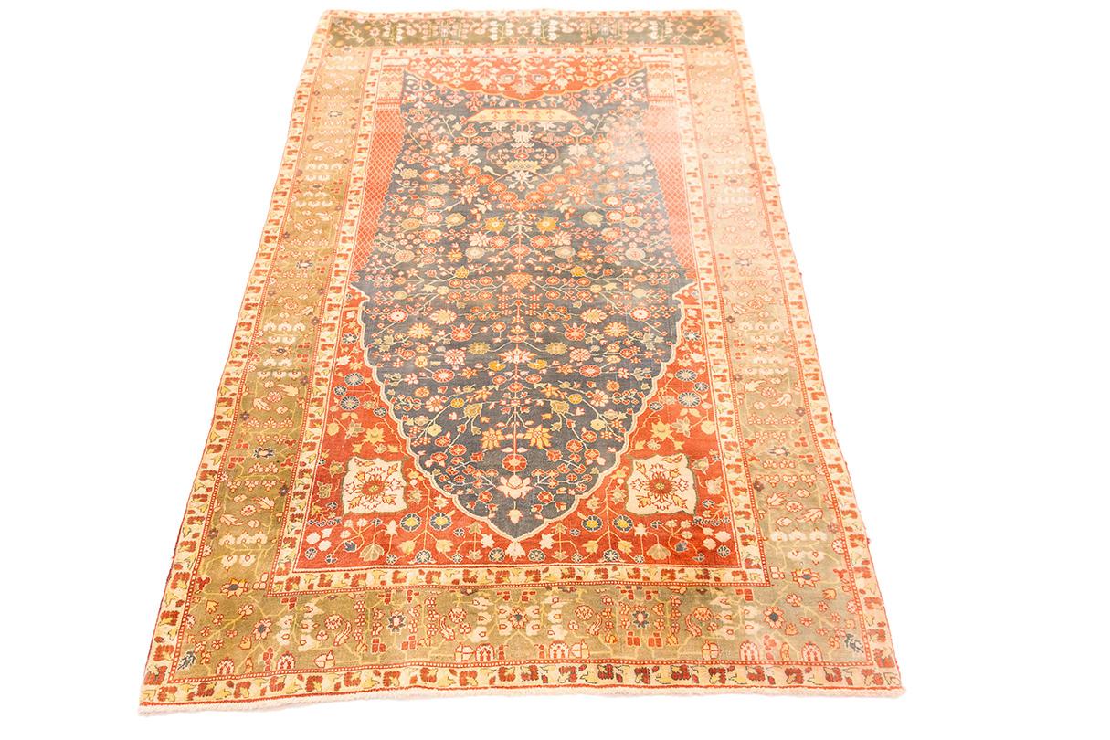 This exquisite antique Indian rug Pashmina is a prime example of the artistry and craftsmanship that has made Indian rugs renowned worldwide. The rug features a central medallion design, often referred to as a 