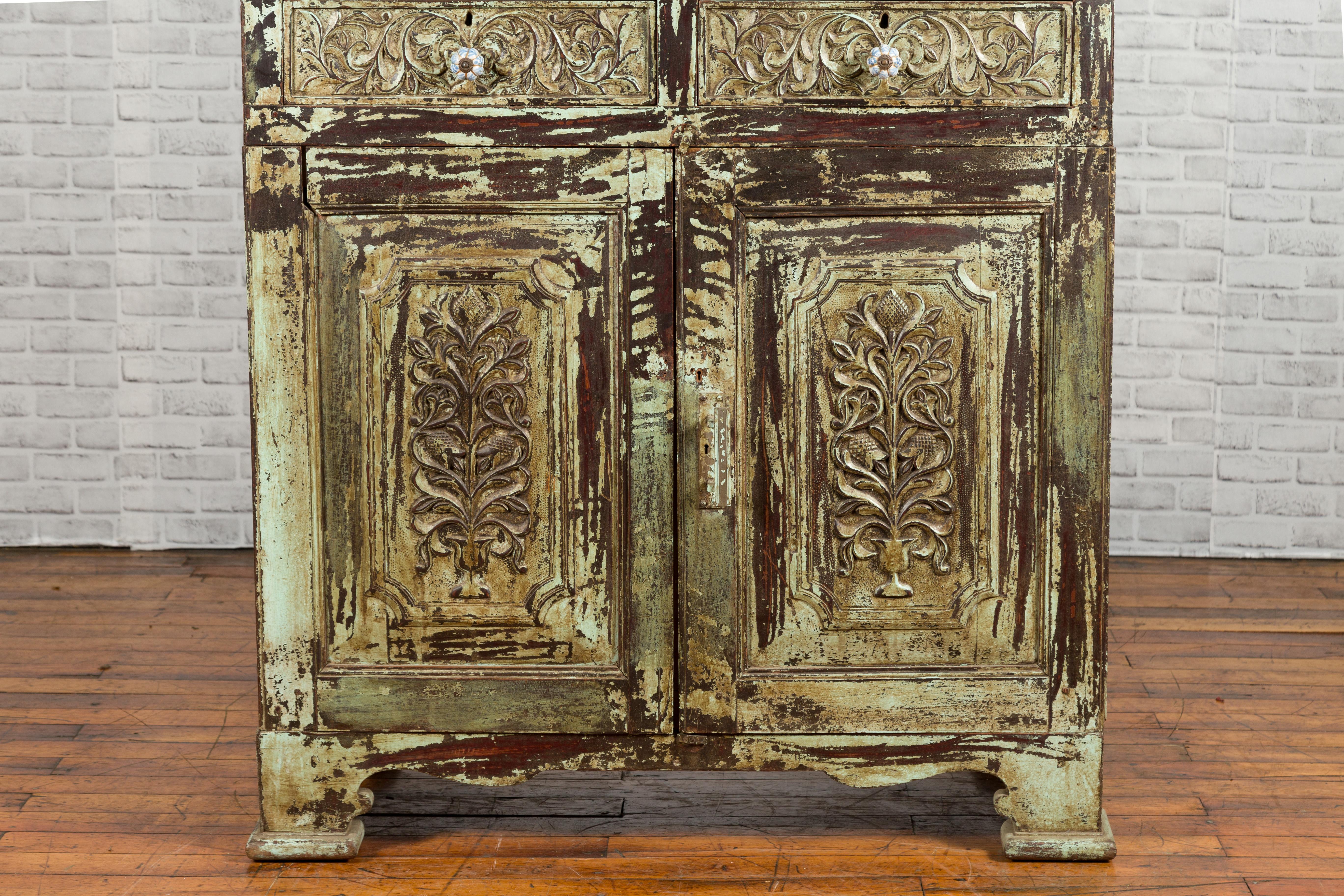 Carved Distress Green and Brown Wood Cabinet with Flower Handles For Sale