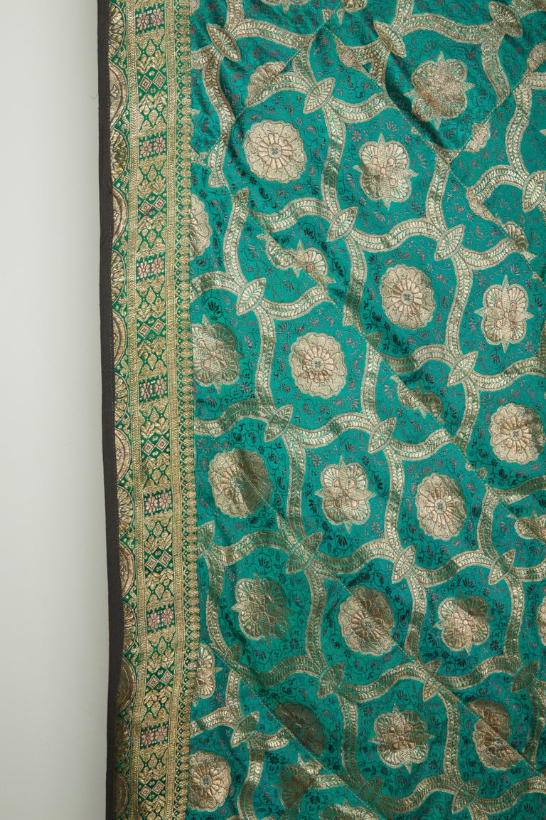 Bangladeshi quilts, known as Kantha, consist of two to three pieces of cloth sewn together with decorative embroidery stitches. They are made out of Saris and are mainly used for bedding, although they may be used as a decorative piece such as a