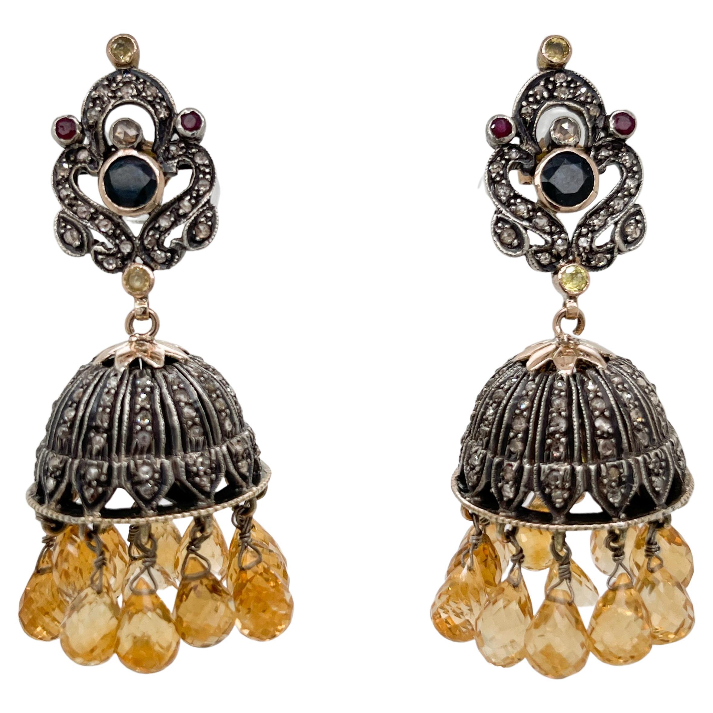 A fine pair of vintage multi-gemstone Jhumka chandelier earrings.

In 14 karat gold and sterling silver. (Posts in 14k gold).

With pave-set polki diamonds covering all surfaces of the chandelier, tube-set rubies, citrines, and sapphires, and