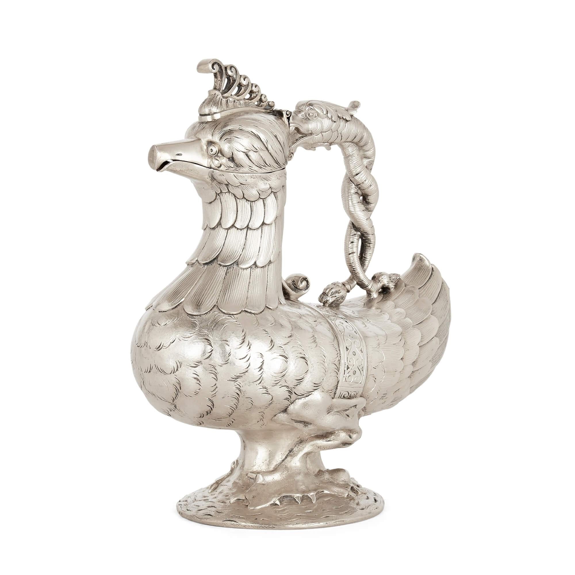 Indian silver mythological bird-form jug
Indian, 19th Century
Height 27cm, width 22cm, depth 12cm

This unusual jug is crafted from silver in the form of a bird being bitten by a dragon. The silver bird, complete with tooled and moulded plumage,