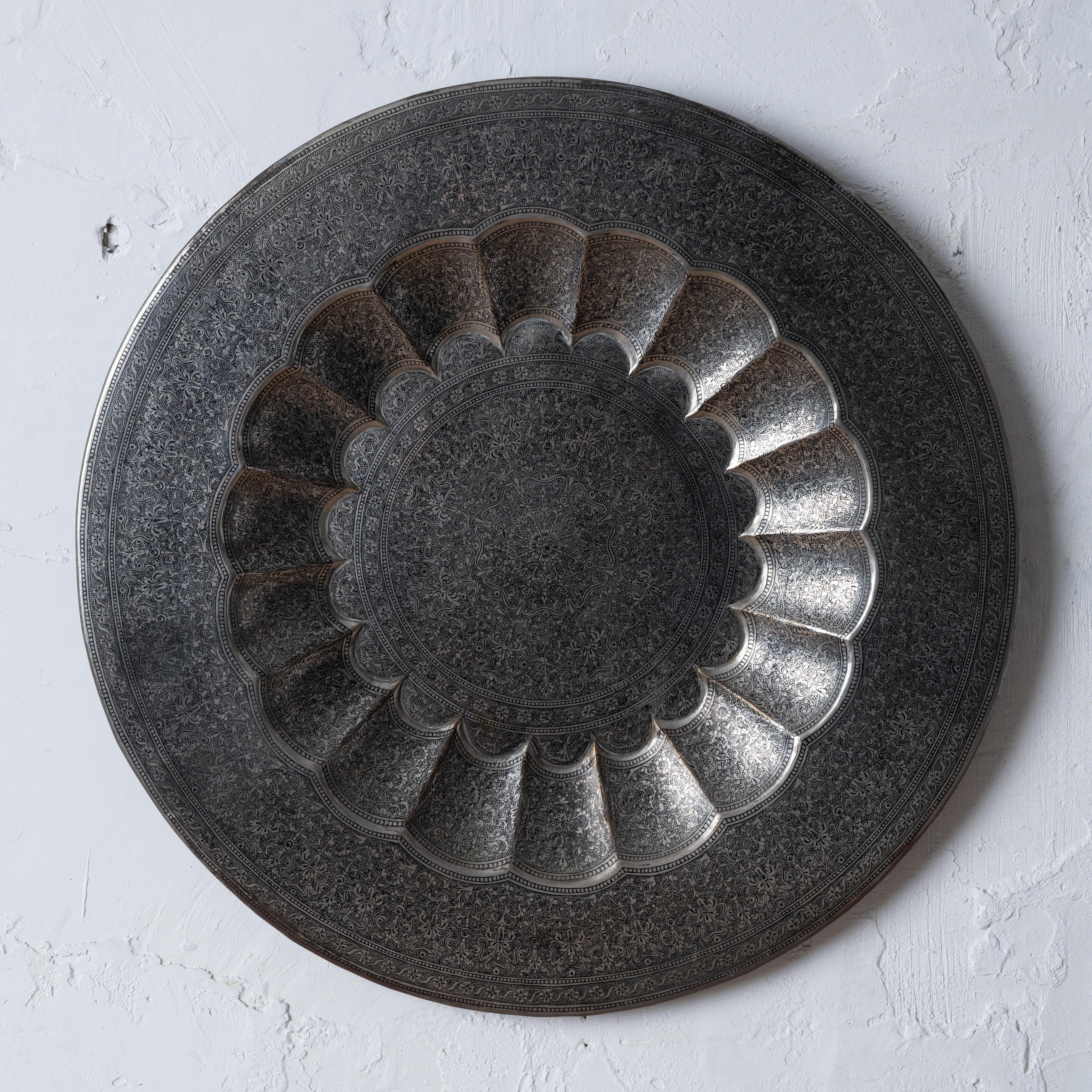 An Indian silverplate tray, early 20th century.



17 inches wide by 1 inch tall


