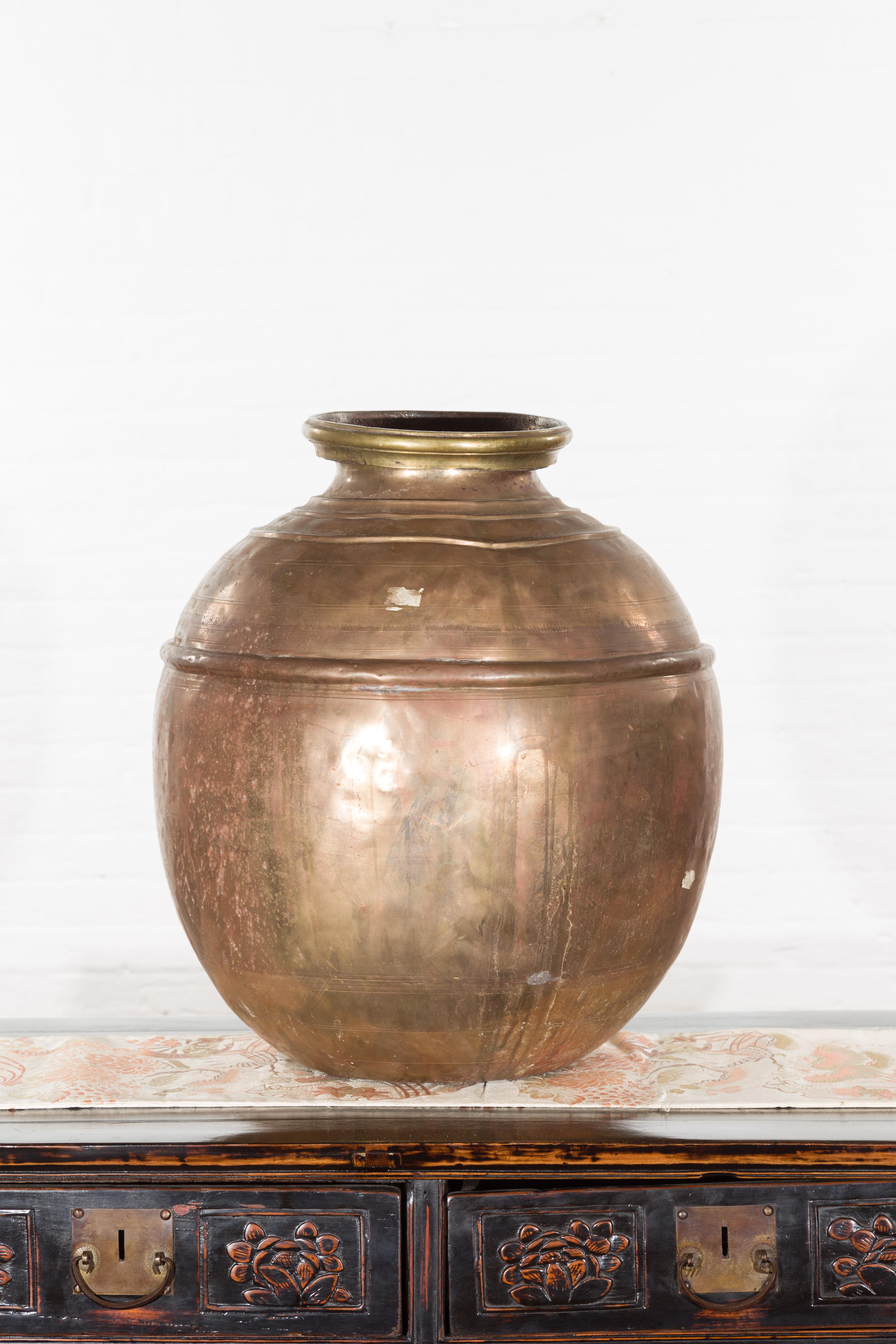 Indian Vintage Brass Water Jar with Concentric Rings and Distressed Appearance 1