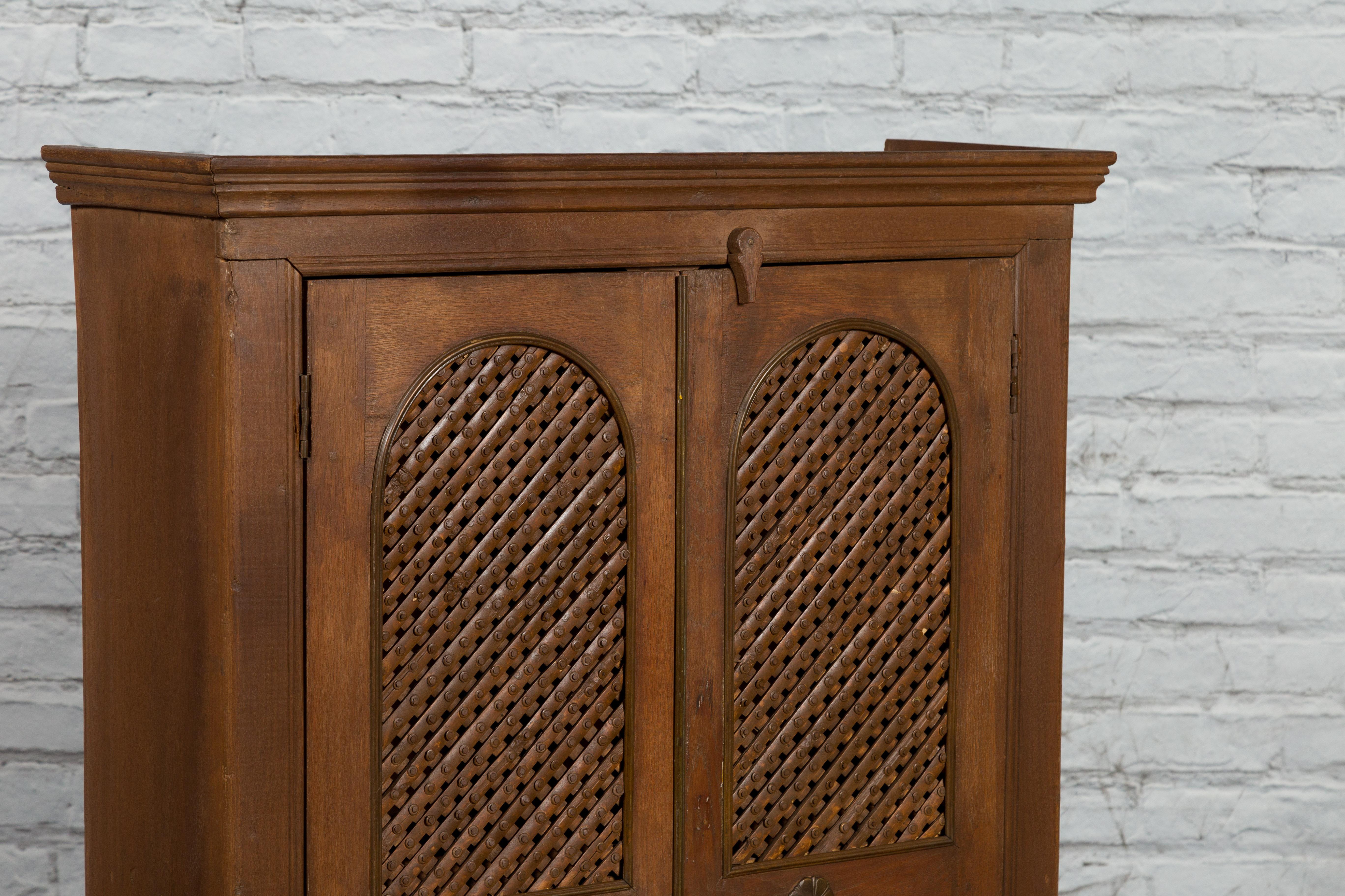 Indian Vintage Wooden Cabinet with Lattice Motifs and Carved Panels For Sale 6