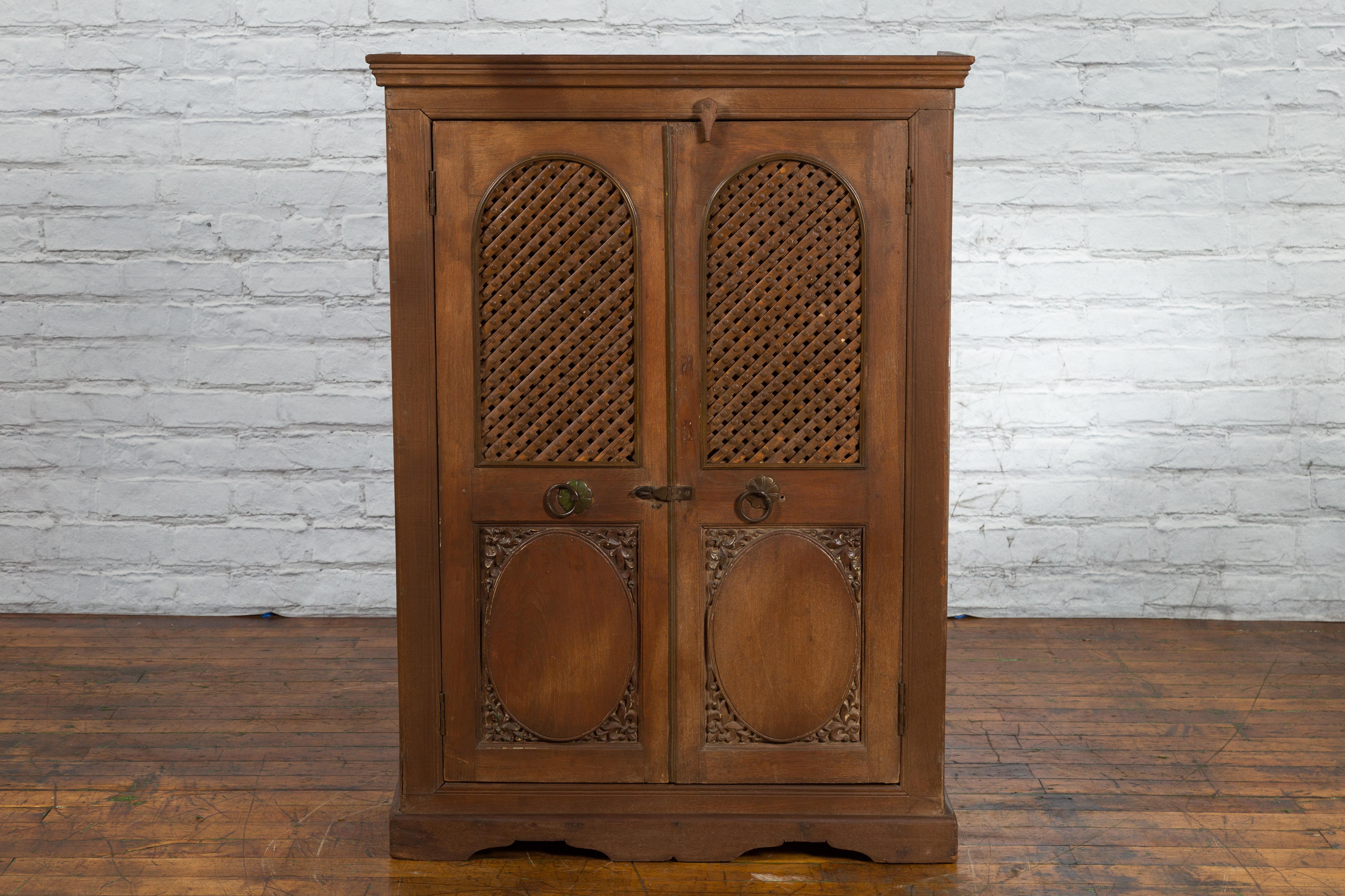 Indian Vintage Wooden Cabinet with Lattice Motifs and Carved Panels In Good Condition For Sale In Yonkers, NY