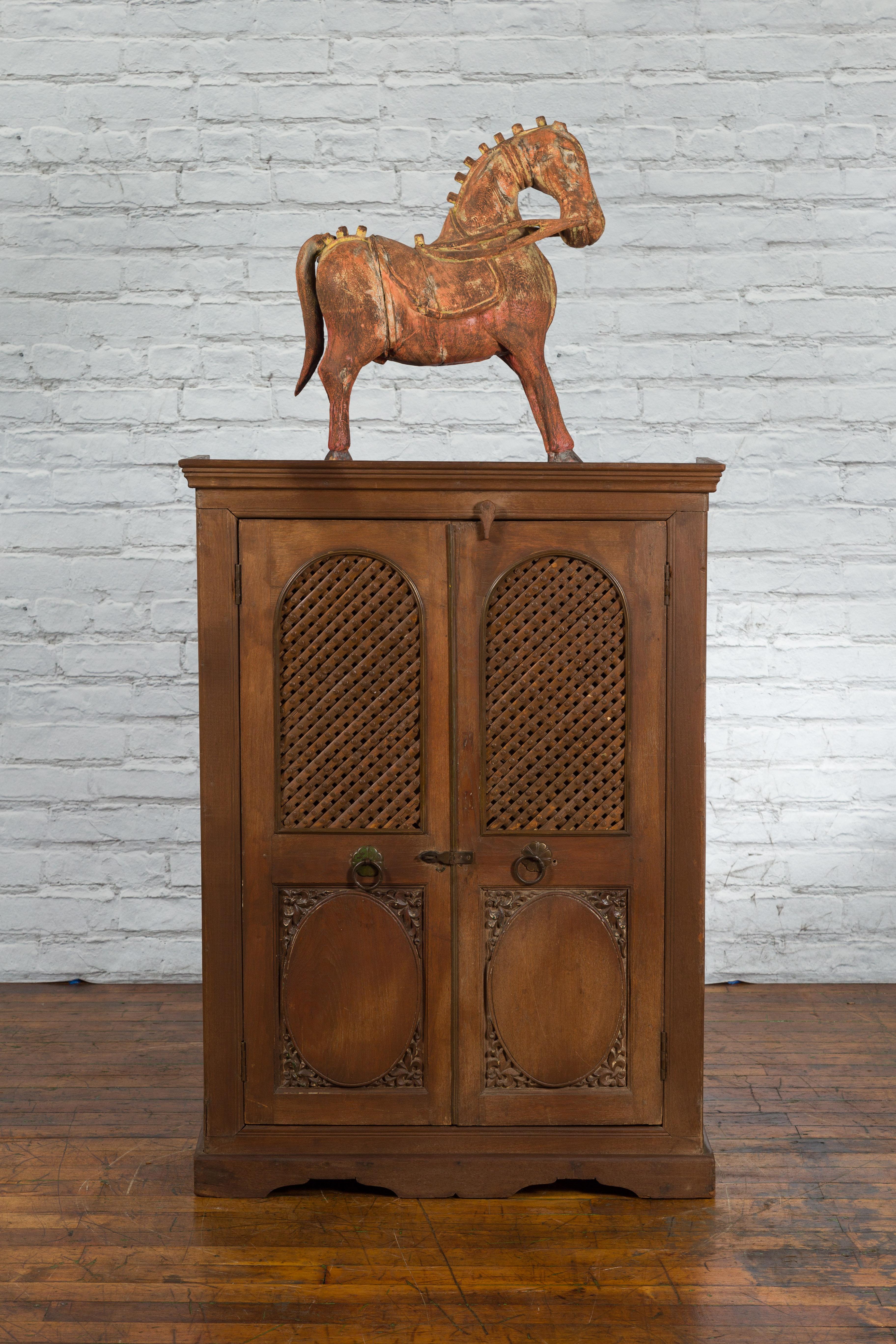 20th Century Indian Vintage Wooden Cabinet with Lattice Motifs and Carved Panels For Sale