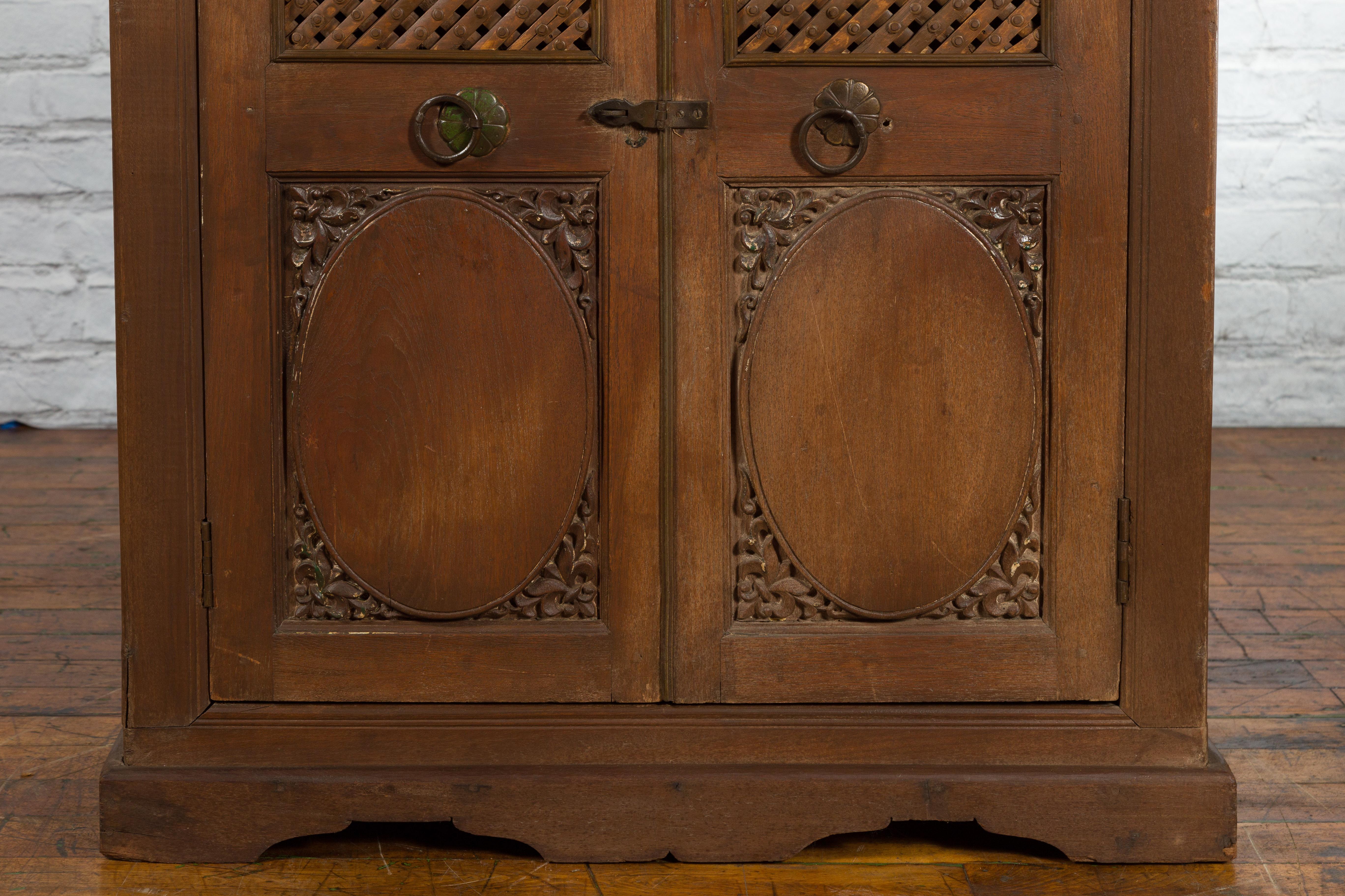 Indian Vintage Wooden Cabinet with Lattice Motifs and Carved Panels For Sale 2