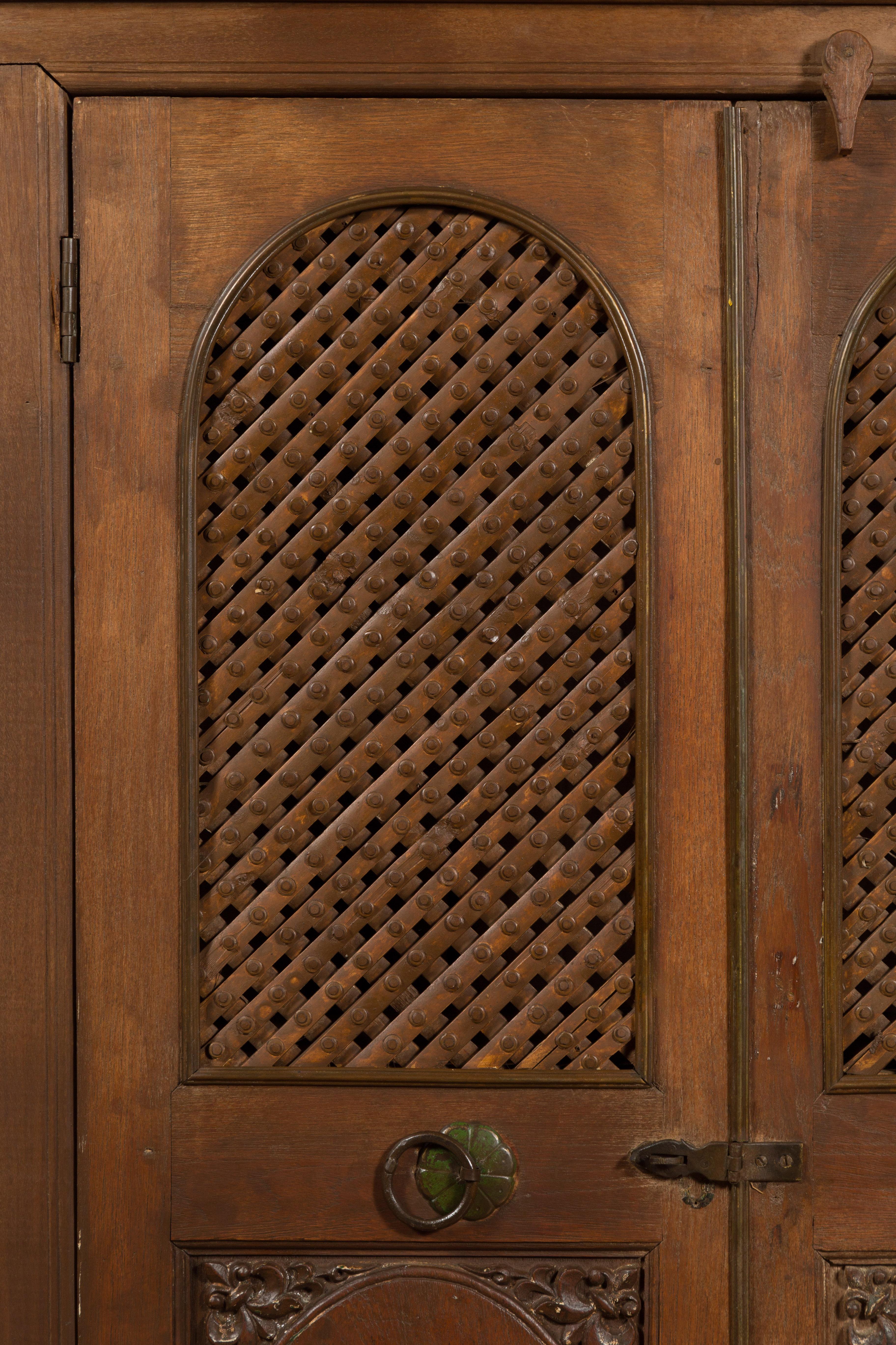 Indian Vintage Wooden Cabinet with Lattice Motifs and Carved Panels For Sale 3
