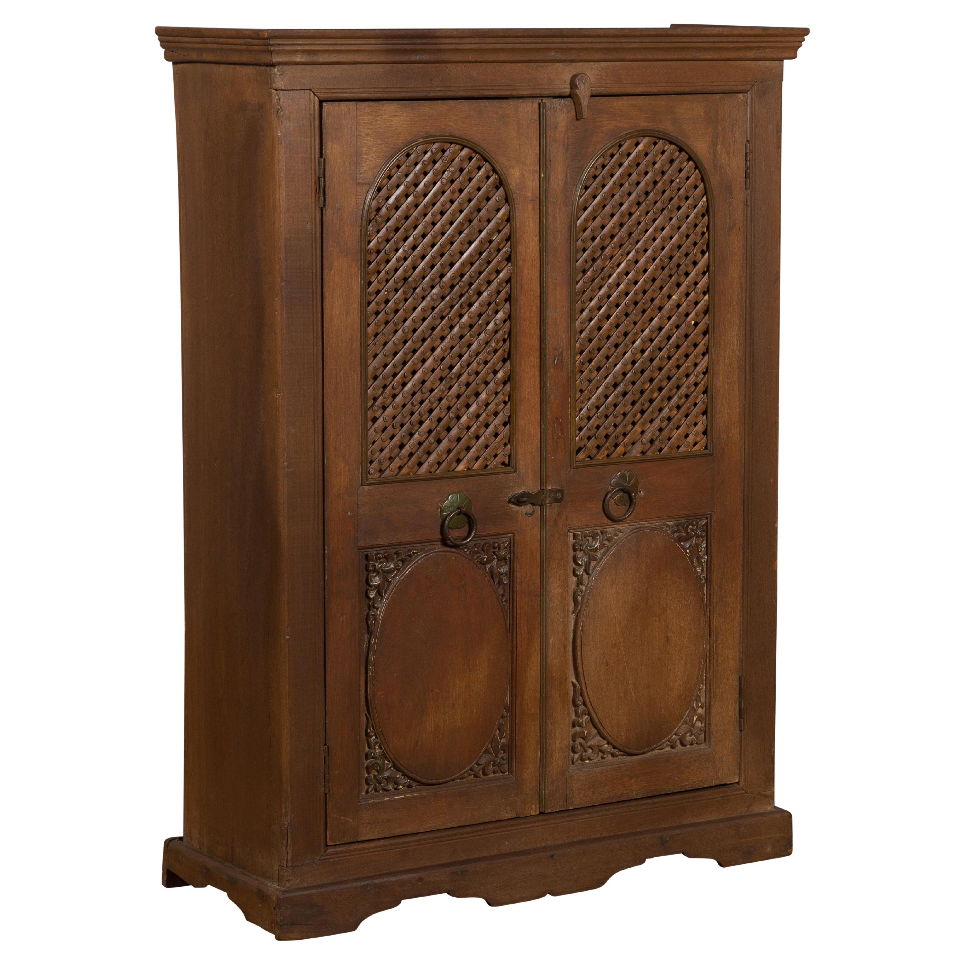 Indian Vintage Wooden Cabinet with Lattice Motifs and Carved Panels For Sale