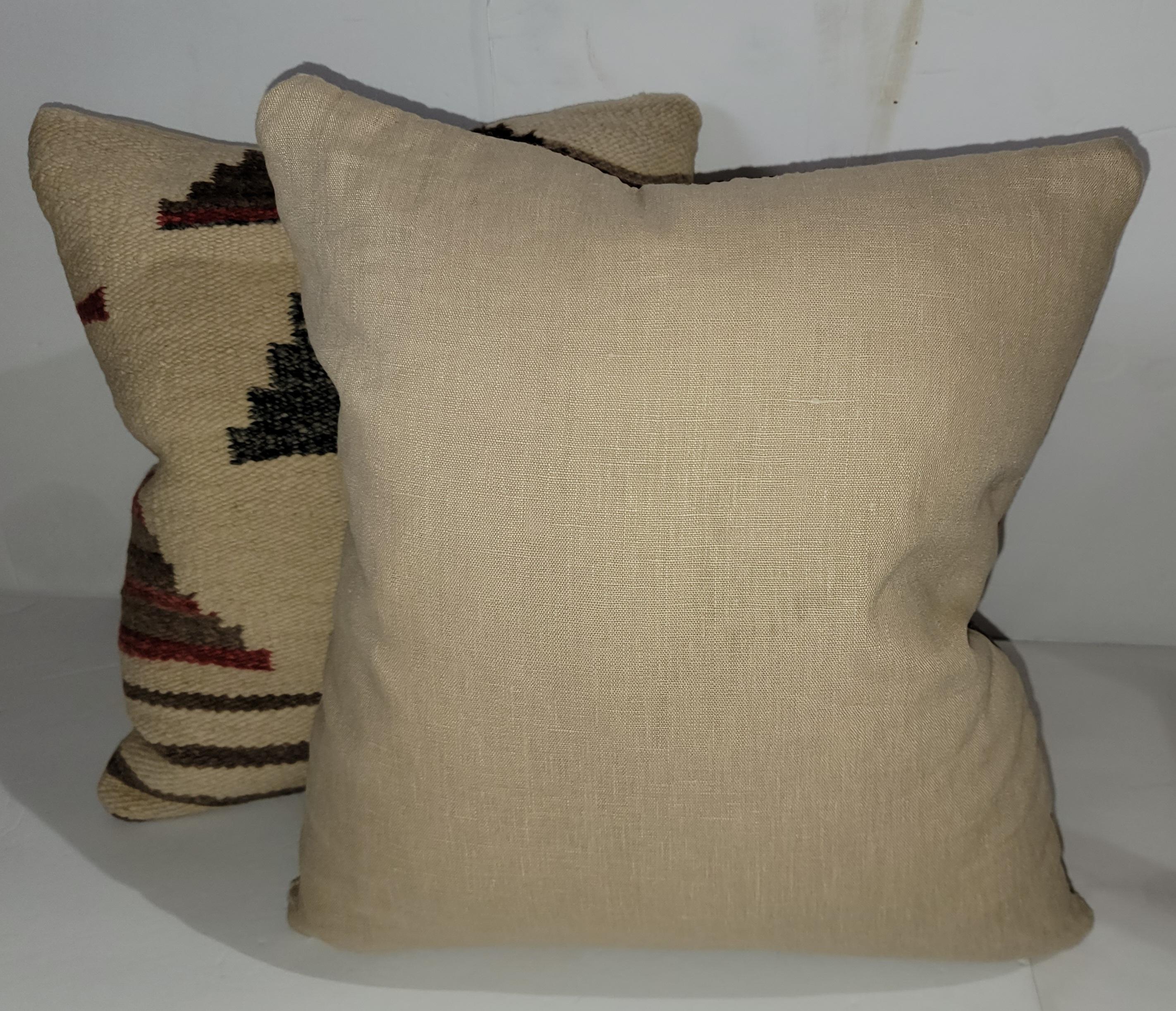 Pair of Indian weaving pillows. Down and feather inserts and zippered cases.
Measures: 15 x 17.