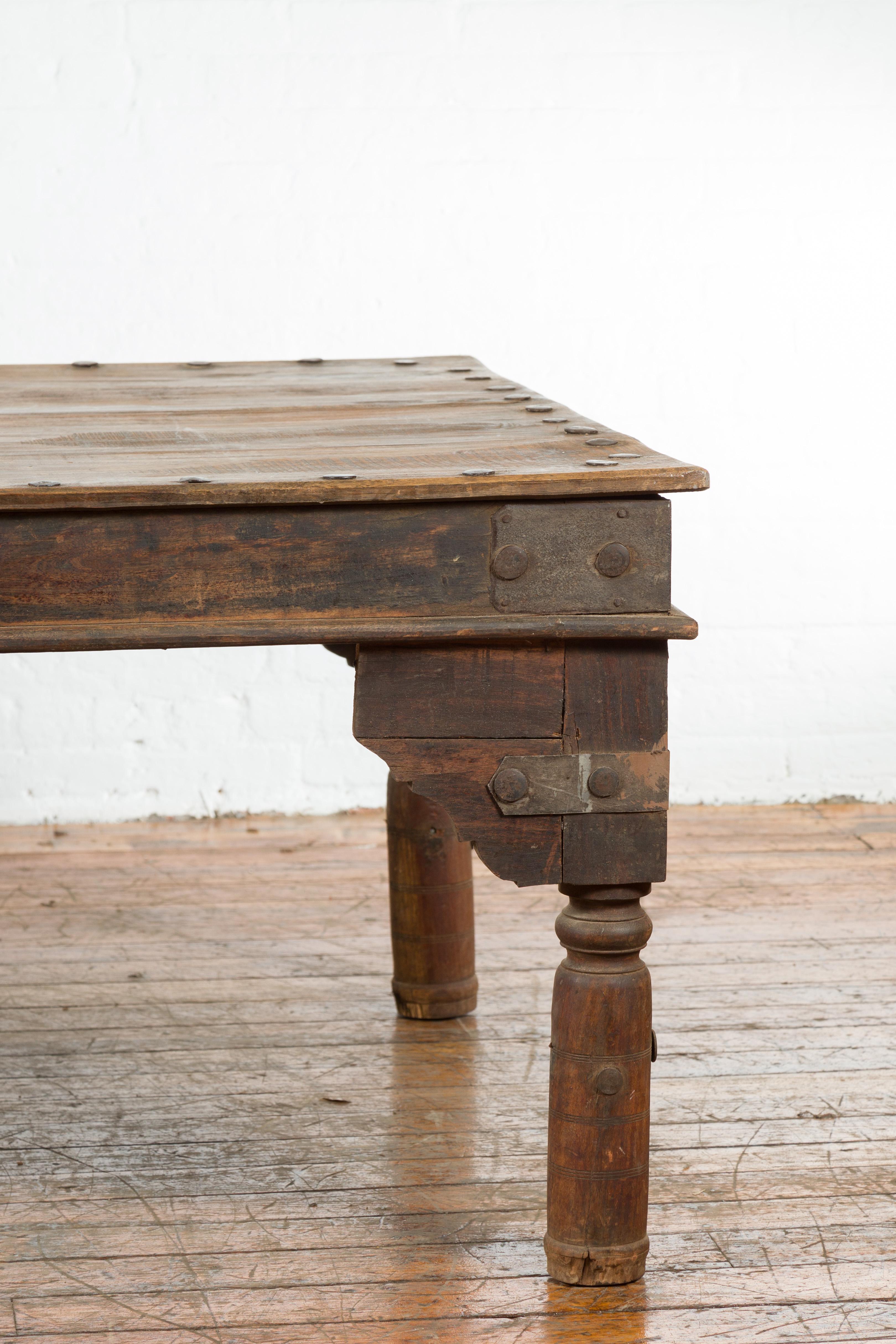 20th Century Indian Wood Dining Table with Distressed Patina, Iron Details and Baluster Legs For Sale