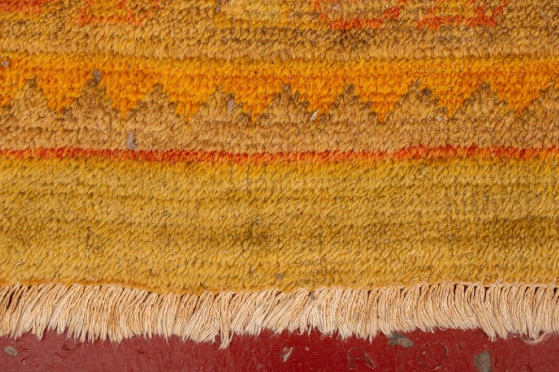 Indian Wool Pile Carpet in orange and yellow, labeled  
