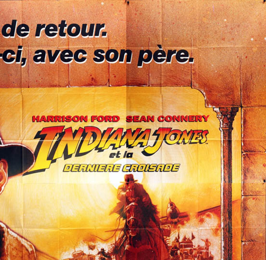 Le dessin de Struzan pour l'affiche du film français Indiana Jones et la dernière croisade est une affiche saisissante, surtout à l'échelle de ce panneau d'affichage 8 feuilles. Le qualifier de surdimensionné est un euphémisme ! Il mesure environ