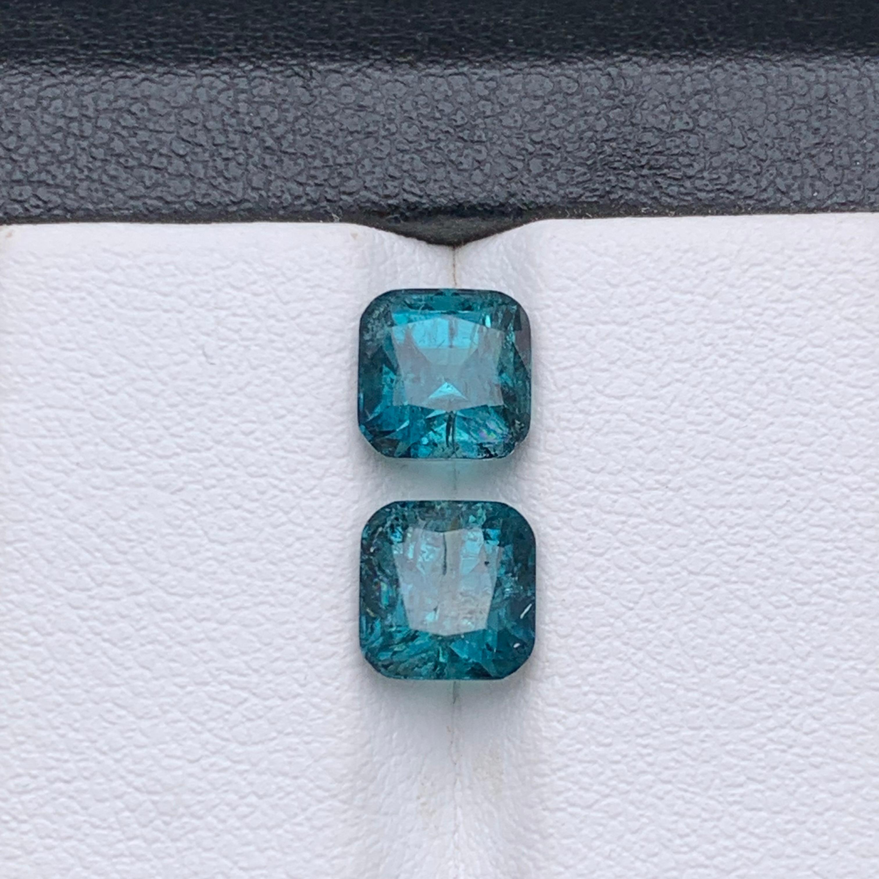 Indicolite Blue Natural Tourmaline Loose Gemstones Perfect Pair for Ring, Earrings or any other Jewelry Setting!!

💎 GEMSTONE TYPE: Tourmaline 
⚖️ WEIGHT: 3.75 Carats
🪚 SHAPE & CUT: Square Cushion Cut
📏 SIZE (MM): 
1.90 Ct (6.77 x 6.68 x