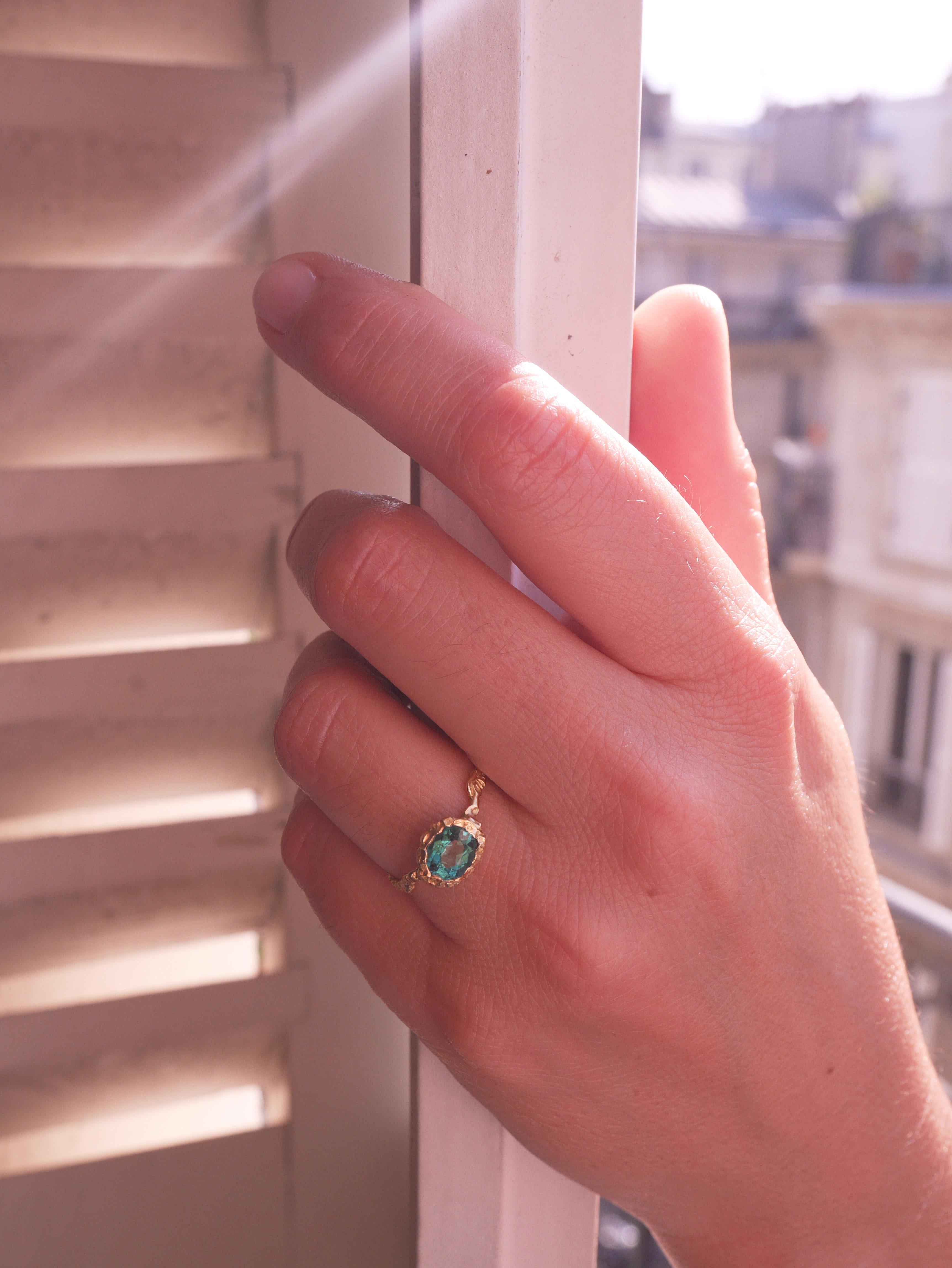 This ring is meticulously handcrafted and cast from 18 Karat yellow gold and its weight is approximately 3 grams. It is set with a green Indicolite Tourmaline 1.09 carat sourced from Madagascar.
French size 53/6 US size.
It can be made to size upon