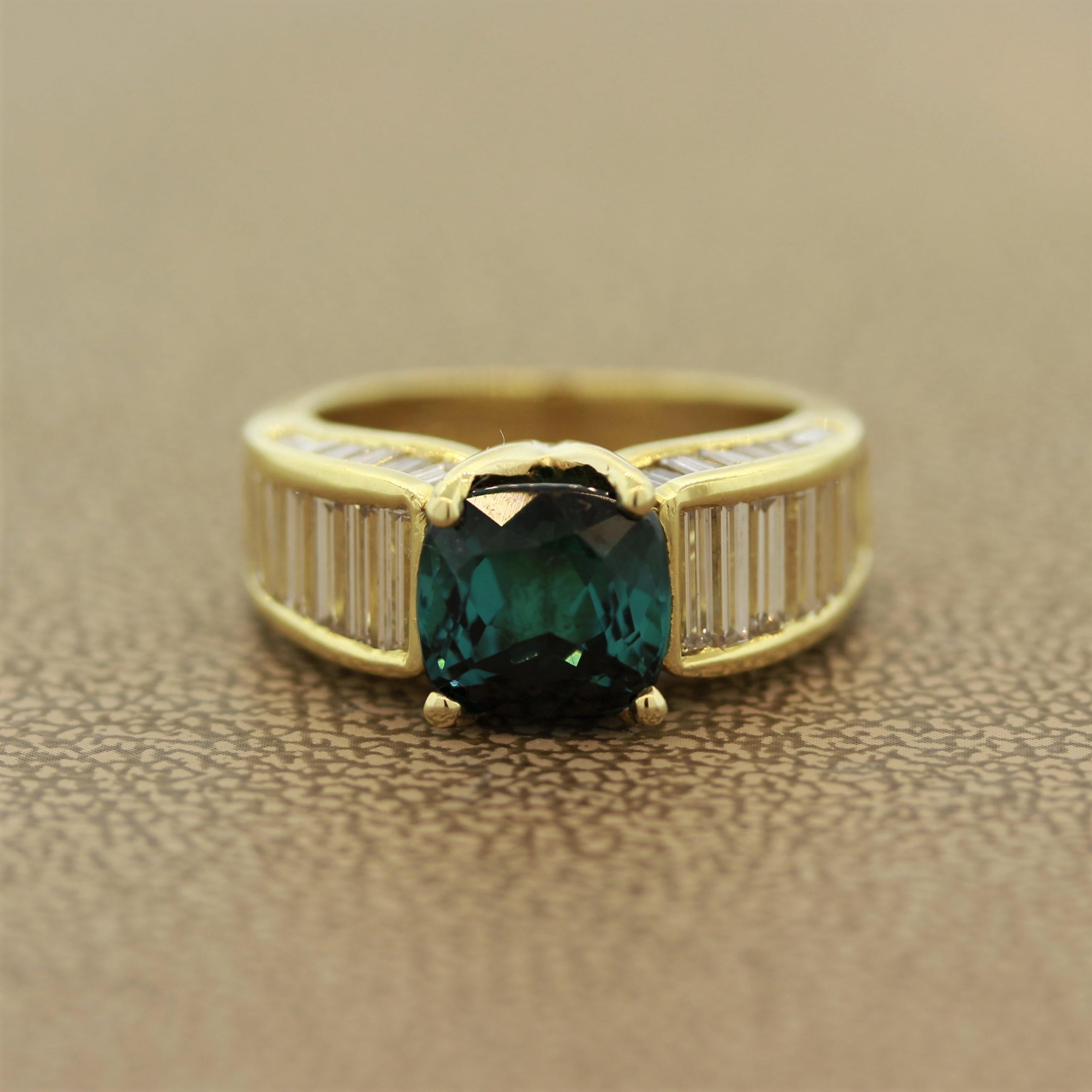 This ring features a fine blue tourmaline, known as indicolite in the trade, weighing 3.16 carats. It is cut as a cushion and has a deep vivid color and free of any noticeable inclusions. It is complemented by 2.47 carats of tapered baguette cut