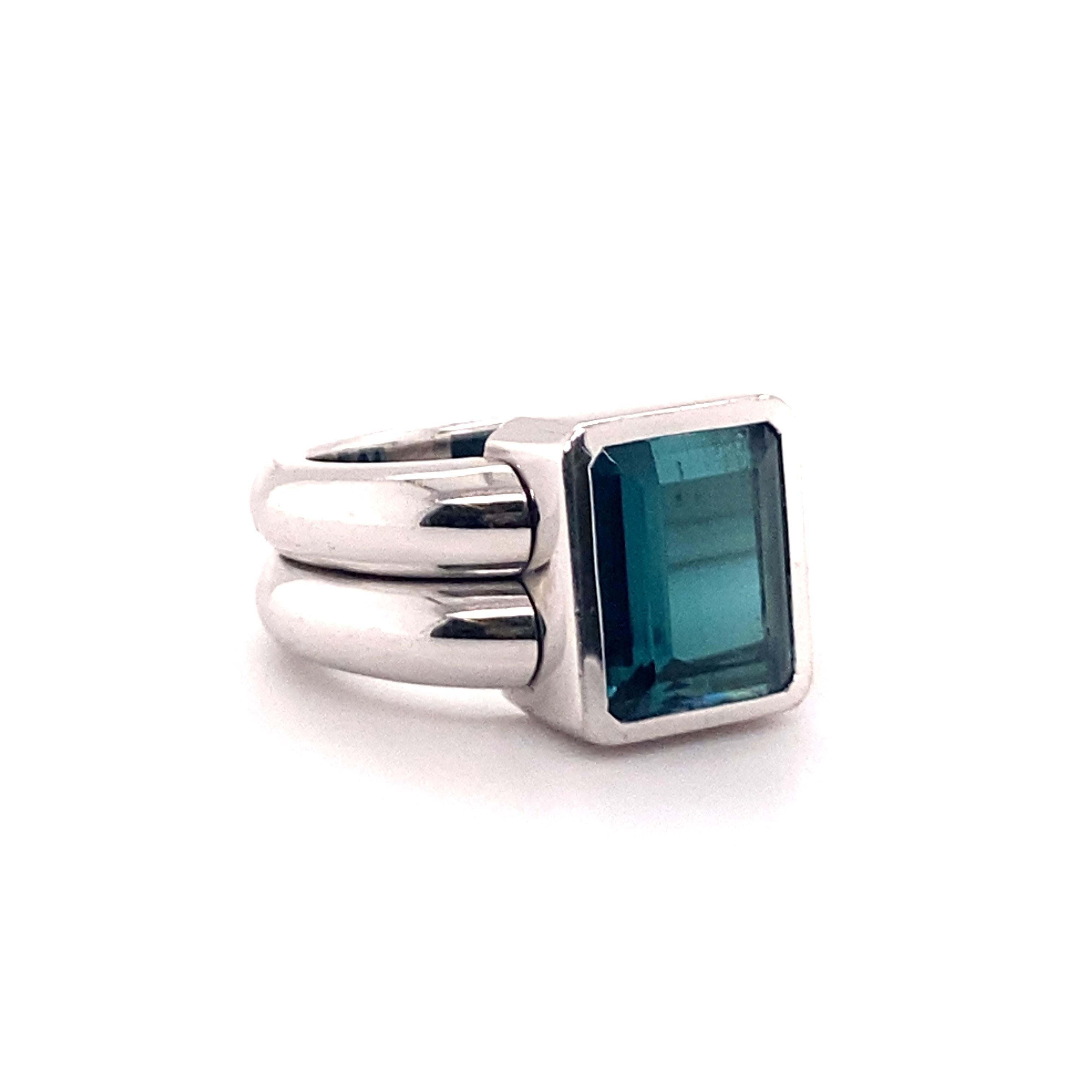 This modern ring features a beautiful indicolite tourmaline of 4.48 carats. 
Bezel set in a two-rail shank, this ring by reknowned Swiss jeweller Péclard exudes a unique and bold elegance.

Indicolite tourmaline dimensions approx.: 11.00 x 9.20 x