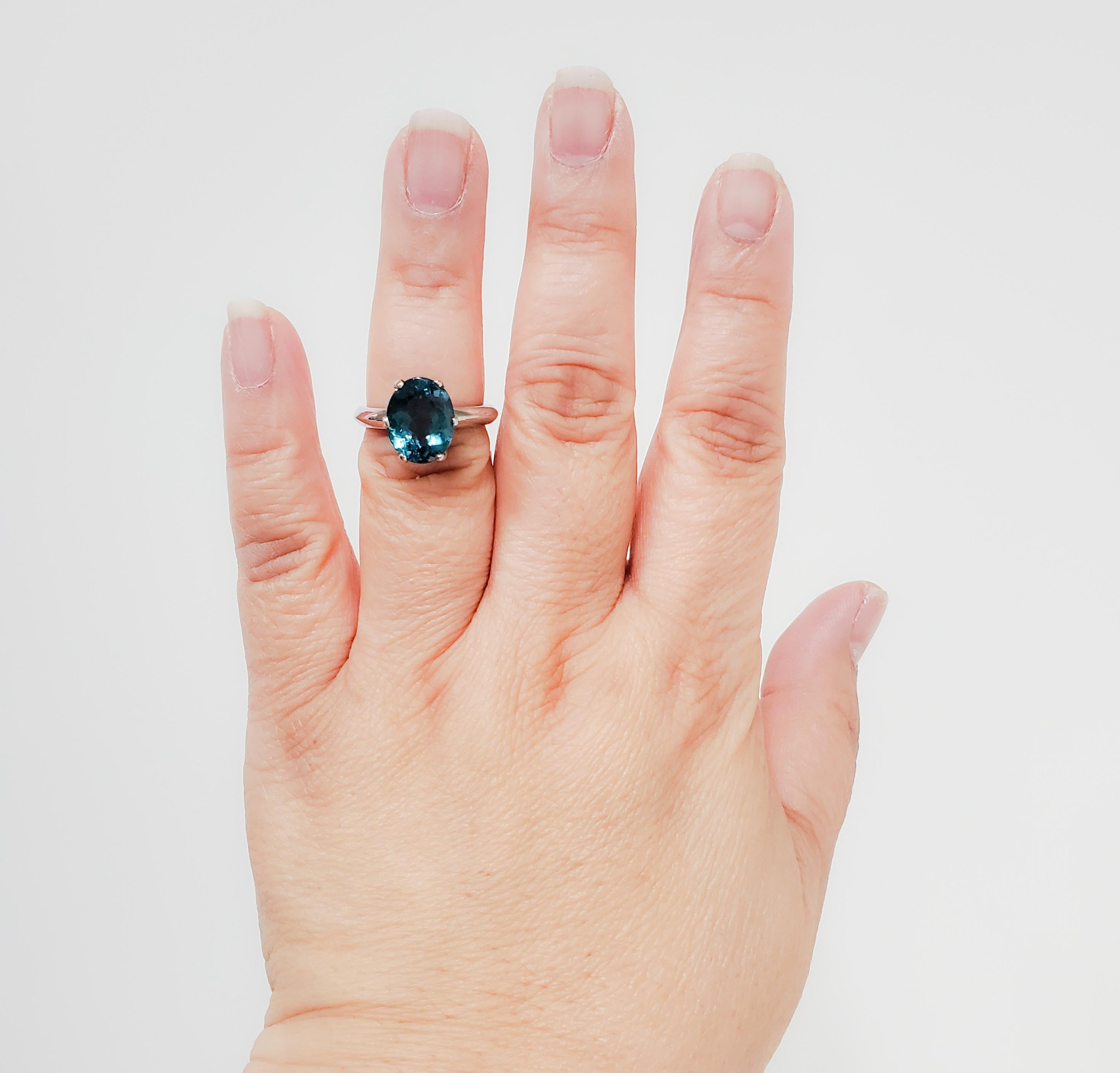 Gorgeous 5.36 ct. indicolite tourmaline oval with a rich unique color.  Handmade platinum mounting.  Ring size 7.