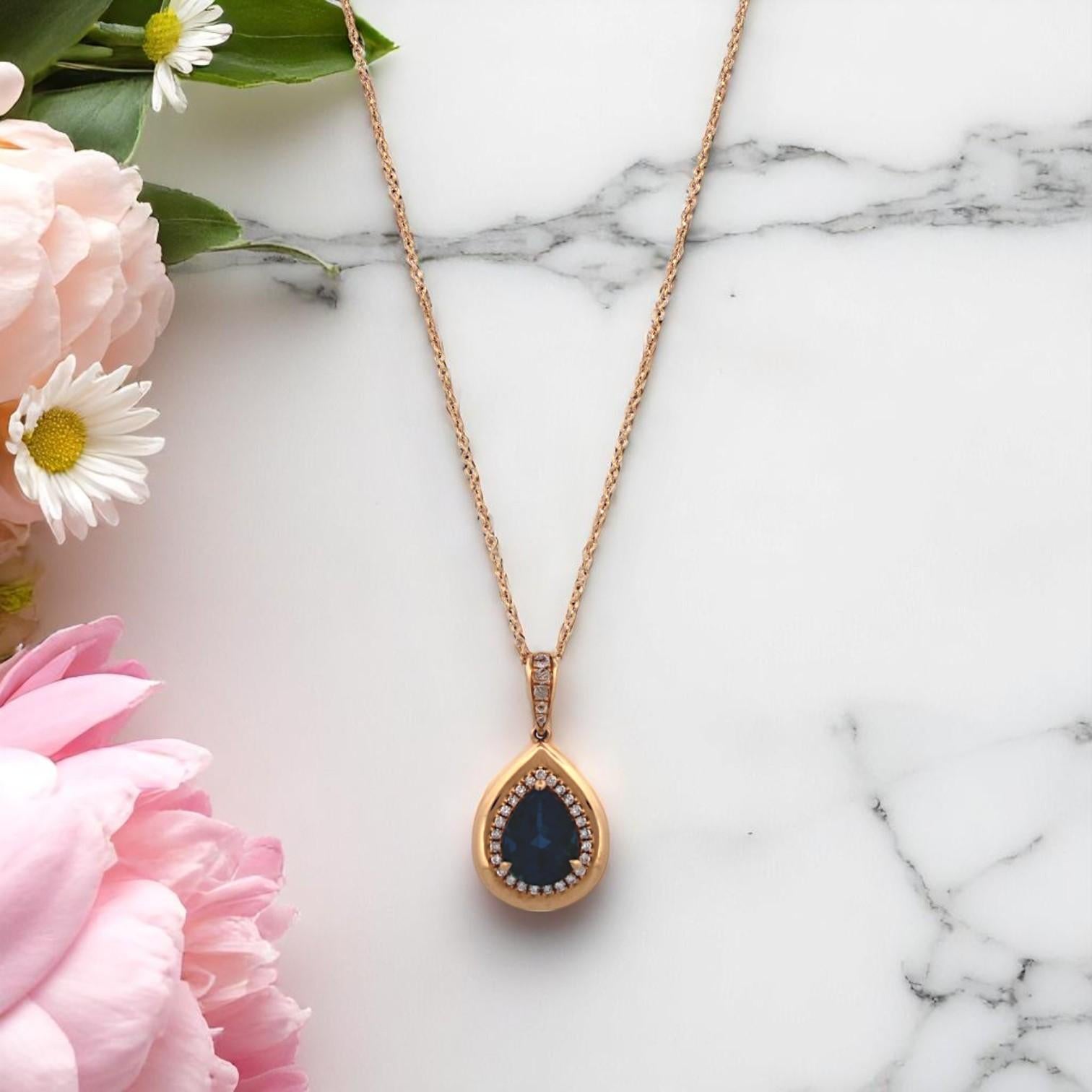 Bold yet balanced, the Indie Necklace by Mountain Song Jeweler is for the woman who moves to her own rhythm. Set in glowing 18k yellow gold, this pendant centers around a mesmerizing 1.85 carat London Blue Topaz, shimmering in deep, oceanic hues.