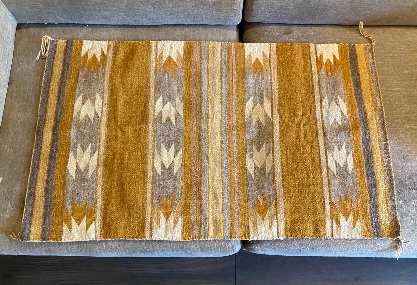 A wonderful, highly engaging, intricately hand woven antique Indigenous Native North American Indian Southwestern Navajo tribe wool rug/blanket featuring a geometric pattern (the Navajo tribe is famed for their geometric designs) and gorgeous, earth