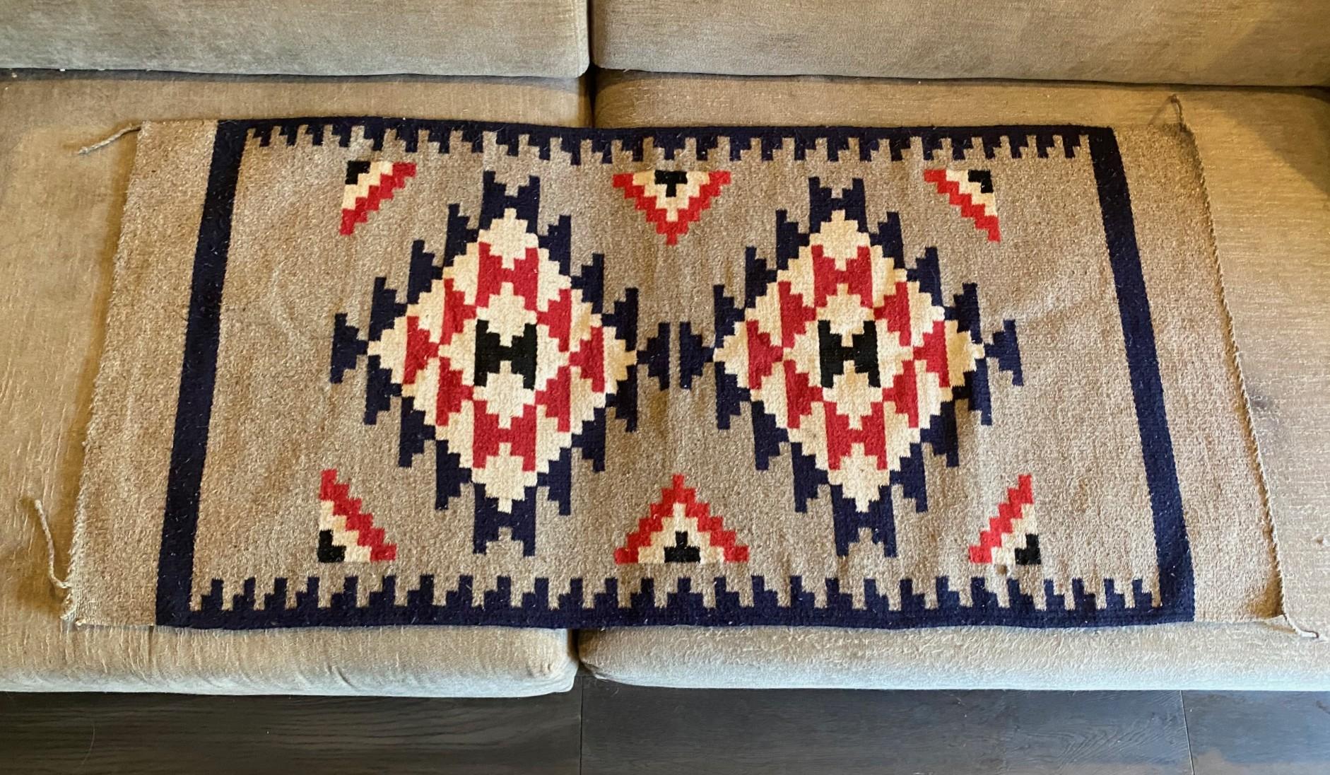 A wonderful, highly engaging, intricately hand woven antique Indigenous Native North American Indian Southwestern Navajo tribe wool rug/blanket featuring a geometric pattern (the Navajo tribe is famed for their geometric designs) and gorgeous, red,