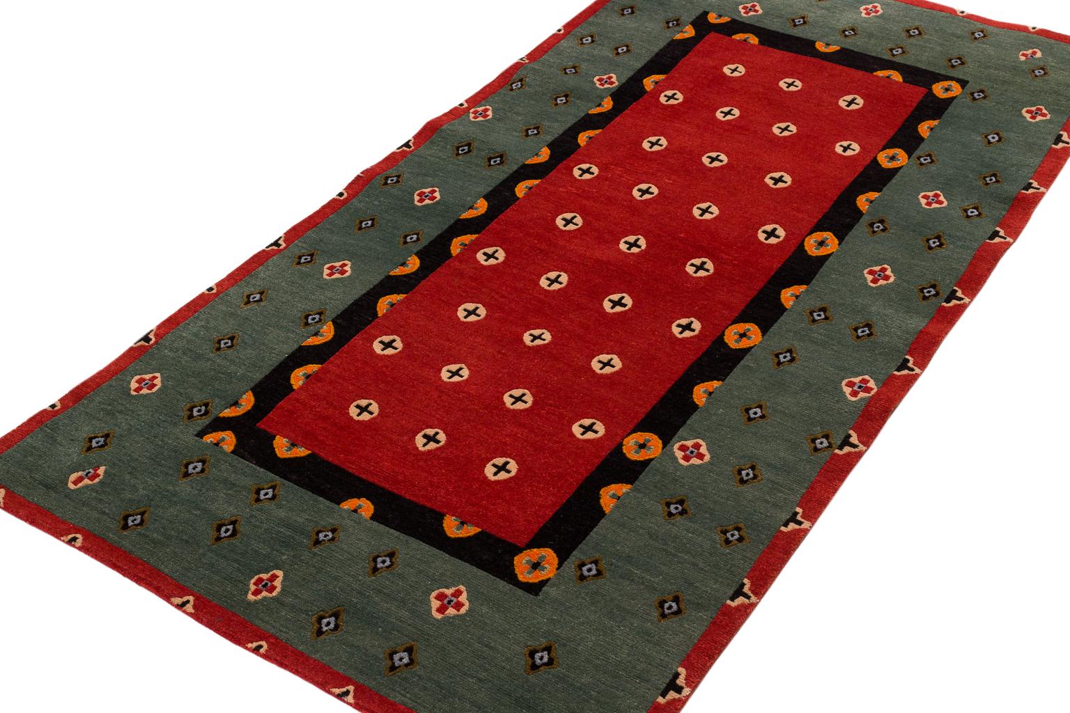 Plus is a beautiful naturally dyed, hand knotted accessory rug or short runner by Joseph Carini. Inspired by ancient ornamentation, this carpet is both traditional and modern. Naturally dyed with vegetable dyes, the border and ground are a rich red