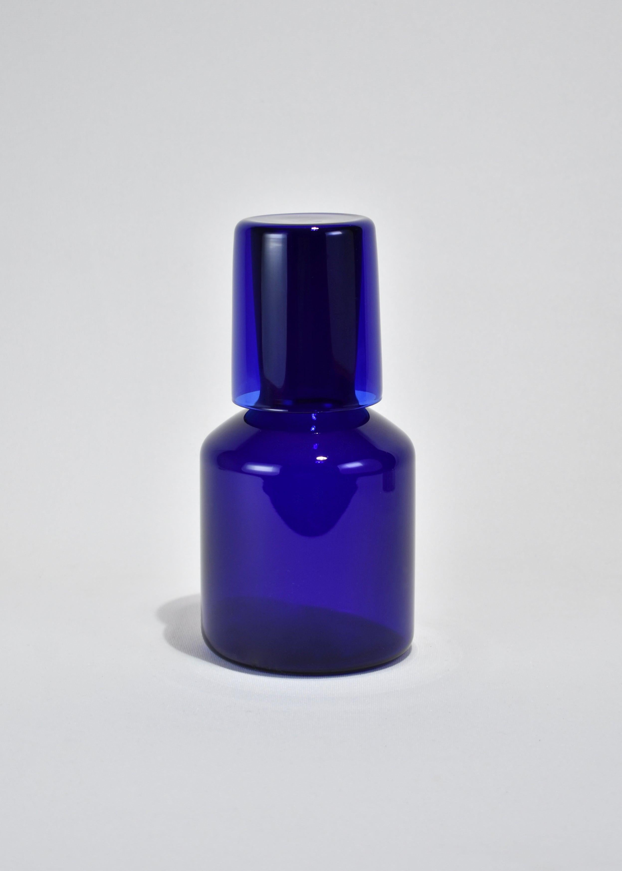 Indigo carafe set by Maison Balzac inspired by the traditional sets used in France and displayed on a bedside table at night. 

Food grade colored glass, individually mouth blown. 
Heat and cold resistant.
Hand wash recommended.
