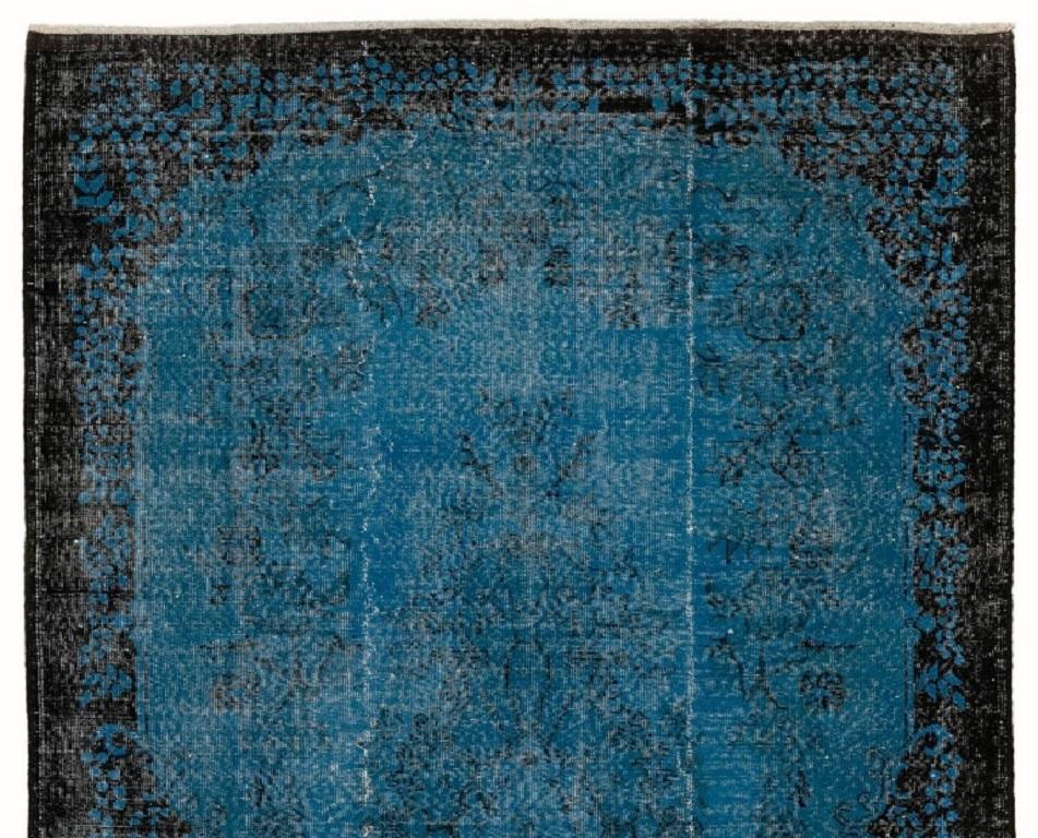 A vintage Turkish rug re-dyed in indigo blue color. Measures: 6.2 x 9.4 ft.
Finely hand knotted, low wool pile on cotton foundation. Deep washed.
Sturdy and can be used on a high traffic area, suitable for both residential and commercial interiors.