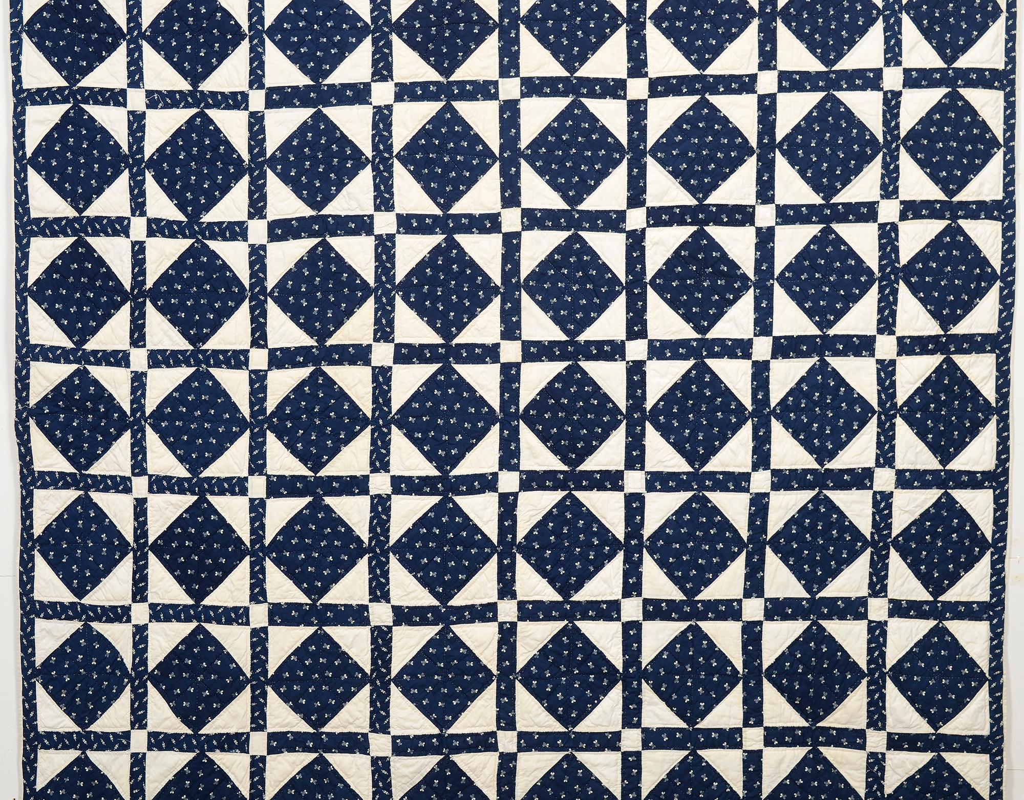 This Economy Patch quilt (aka Diamond in a Square) has a secondary pattern as well. The four triangles adjoining the indigo diamond unite around the sashing to form the pattern known as Texas Puzzle. It is not evident at first, but the pattern has a