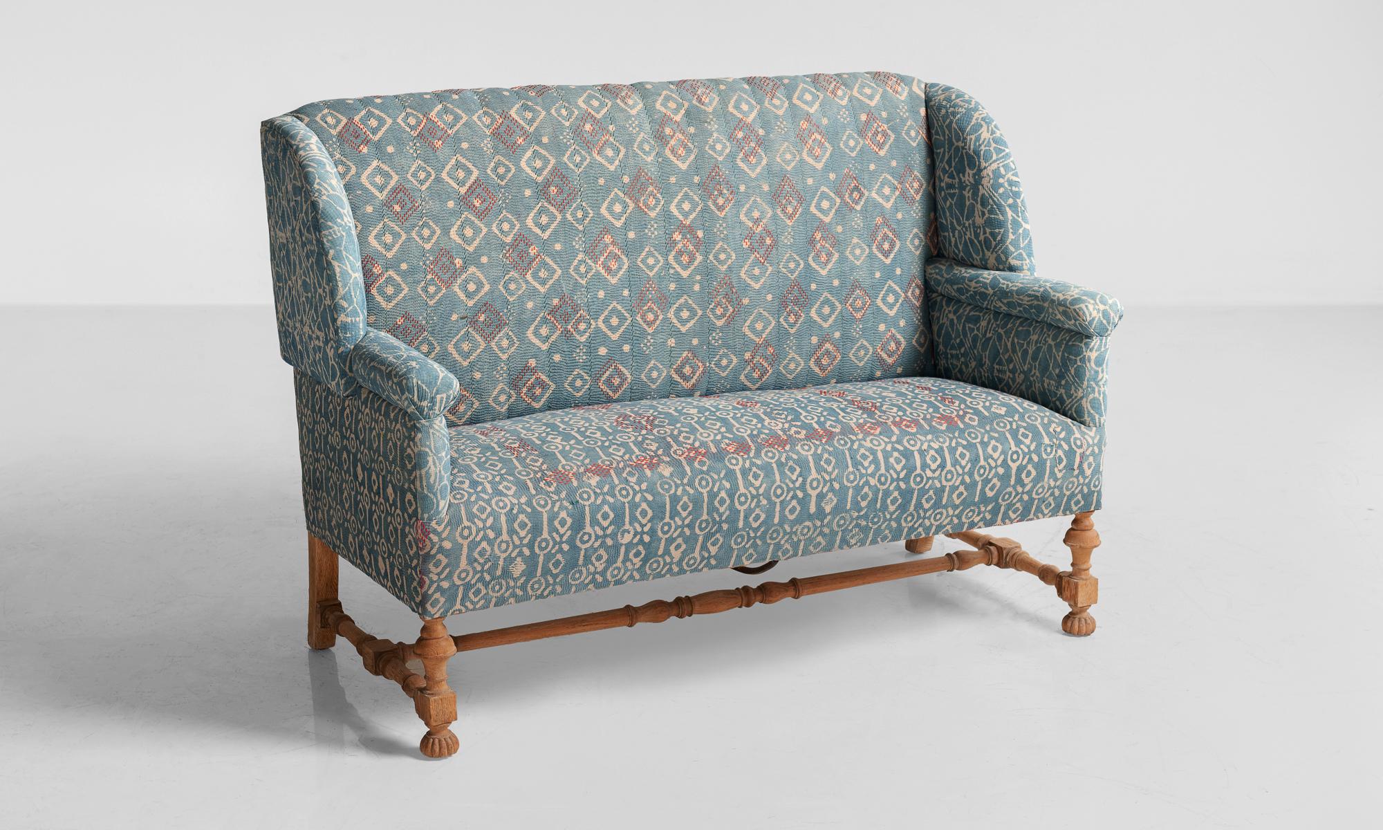 Indigo Quilt sofa, England, circa 1930.

Oak frame in the Arts & Crafts style, newly upholstered in vintage Indigo Quilt. Originally retailed by Liberty of London

Measures: 57