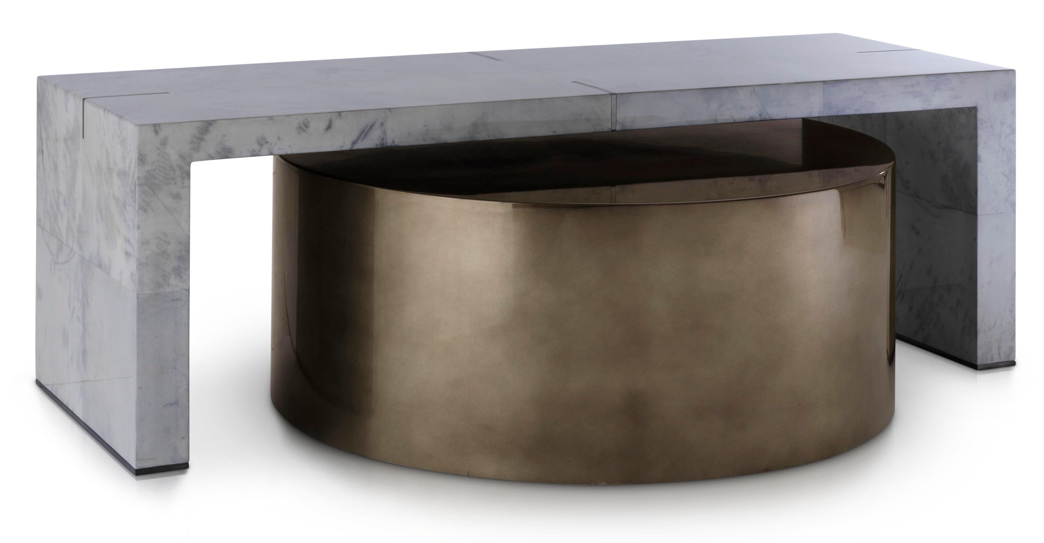 Reminiscent of a twinkling indigo sky studded with brushed gold stars, this modern coffee table is beautifully crafted by master artisans and features metallic pewter leaf trims.

A true statement piece with a touch of the unexpected; set the