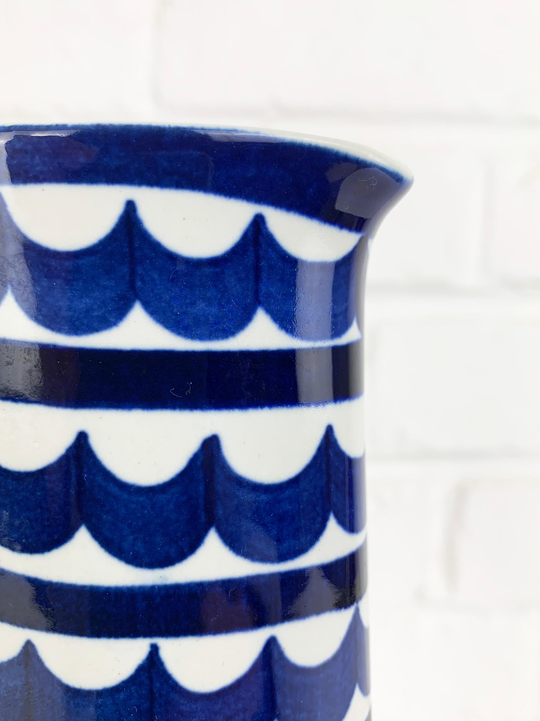 Stoneware Jug designed by Karin Björquist for Gustavsberg, Sweden. Can be used as carafe, pitcher or vase. 

It is part of the Indigo series of stoneware objects with white glaze and blue hand-painted geometric decor she created in 1952.

Very nice