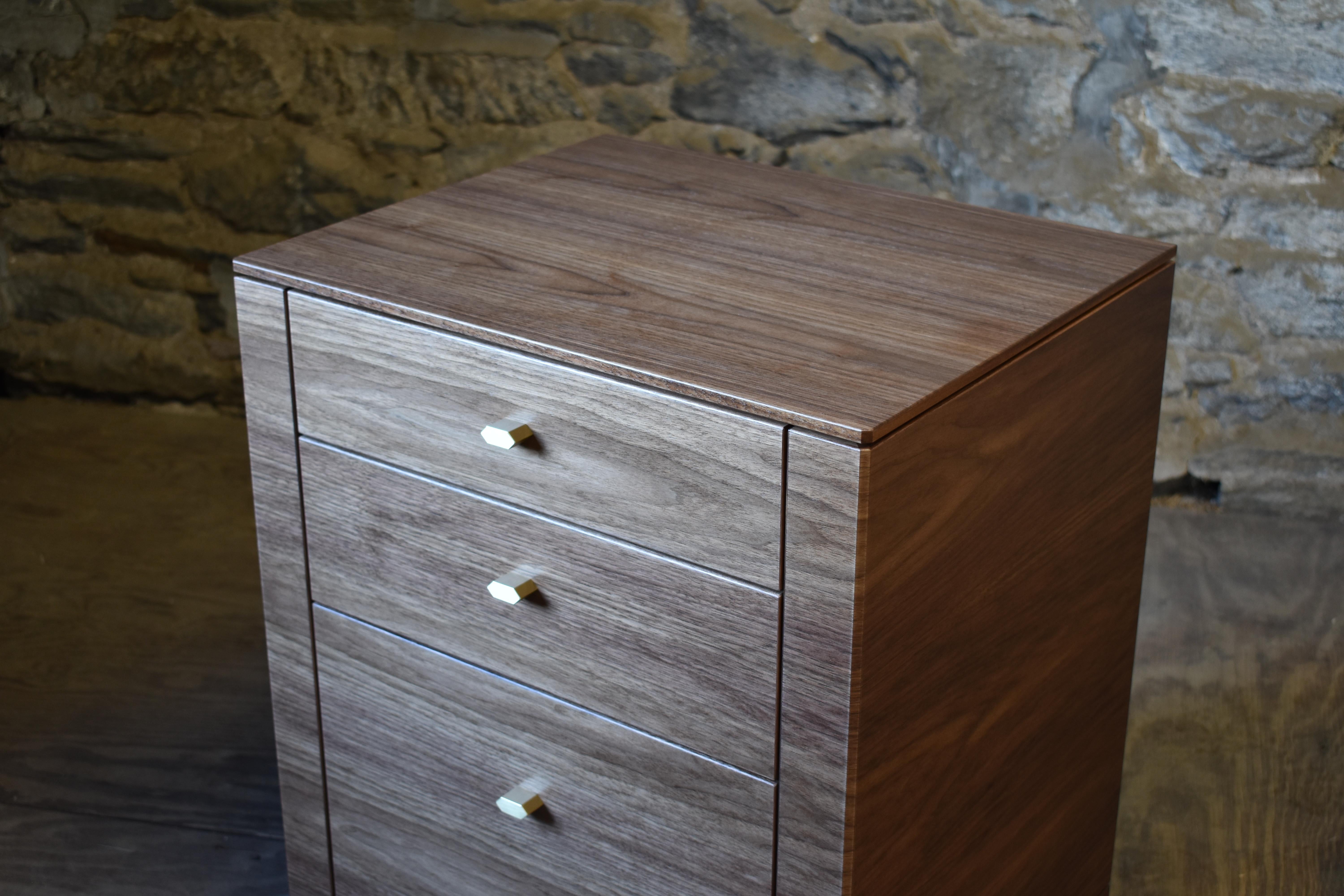 Shown in oiled walnut and brushed brass, the Indio bedside chest features three solid wood drawers with under-mount drawer slides, custom made hardware and a solid walnut base.
Dimensions (as pictured): 22