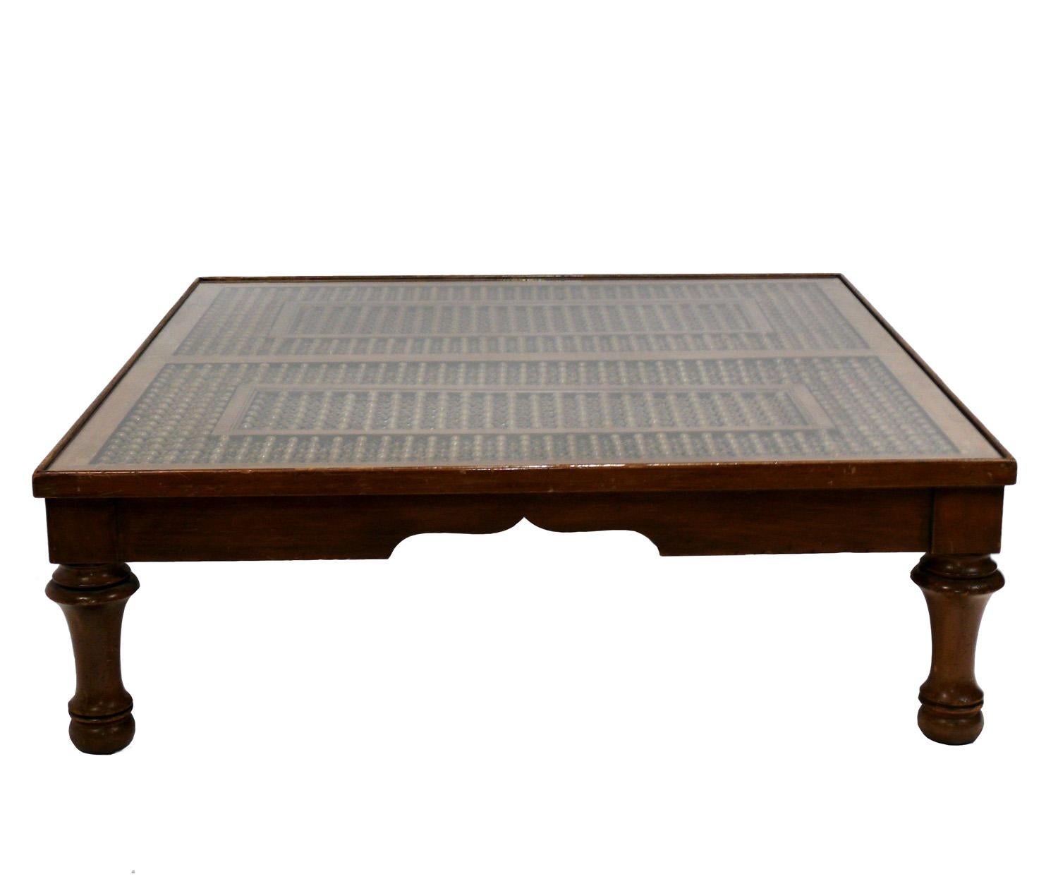 Large scale coffee table, made from an antique Indochinese window screen. The coffee table was probably constructed circa 1960s, the architectural window screen probably much earlier, possibly 19th Century. Retains warm original patina.
