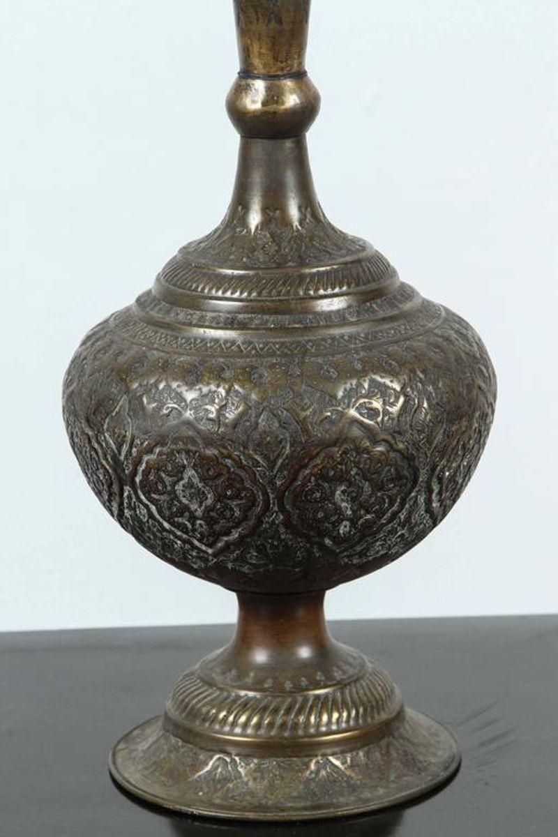Nice patina on this Indo-Persian decorative copper urn with lid, handcrafted in India for the Persian market, embossed and hand chased with floral and geometric designs.
Mameluke style.
Dimensions: 28 in. H x 8 in. D