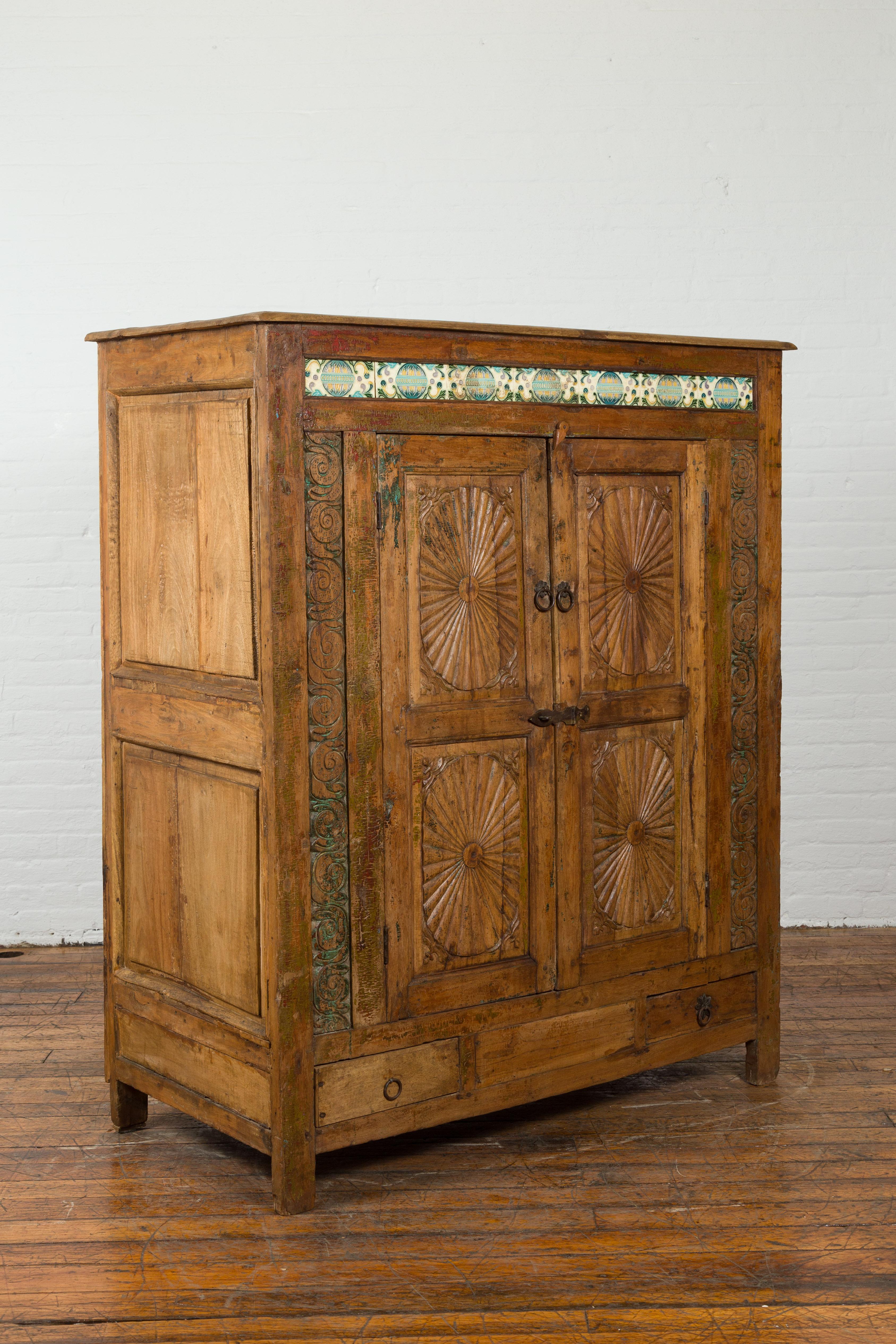 Carved Indonesian 19th Century Cabinet with Sunburst Design and Blue & Yellow Enameled  For Sale