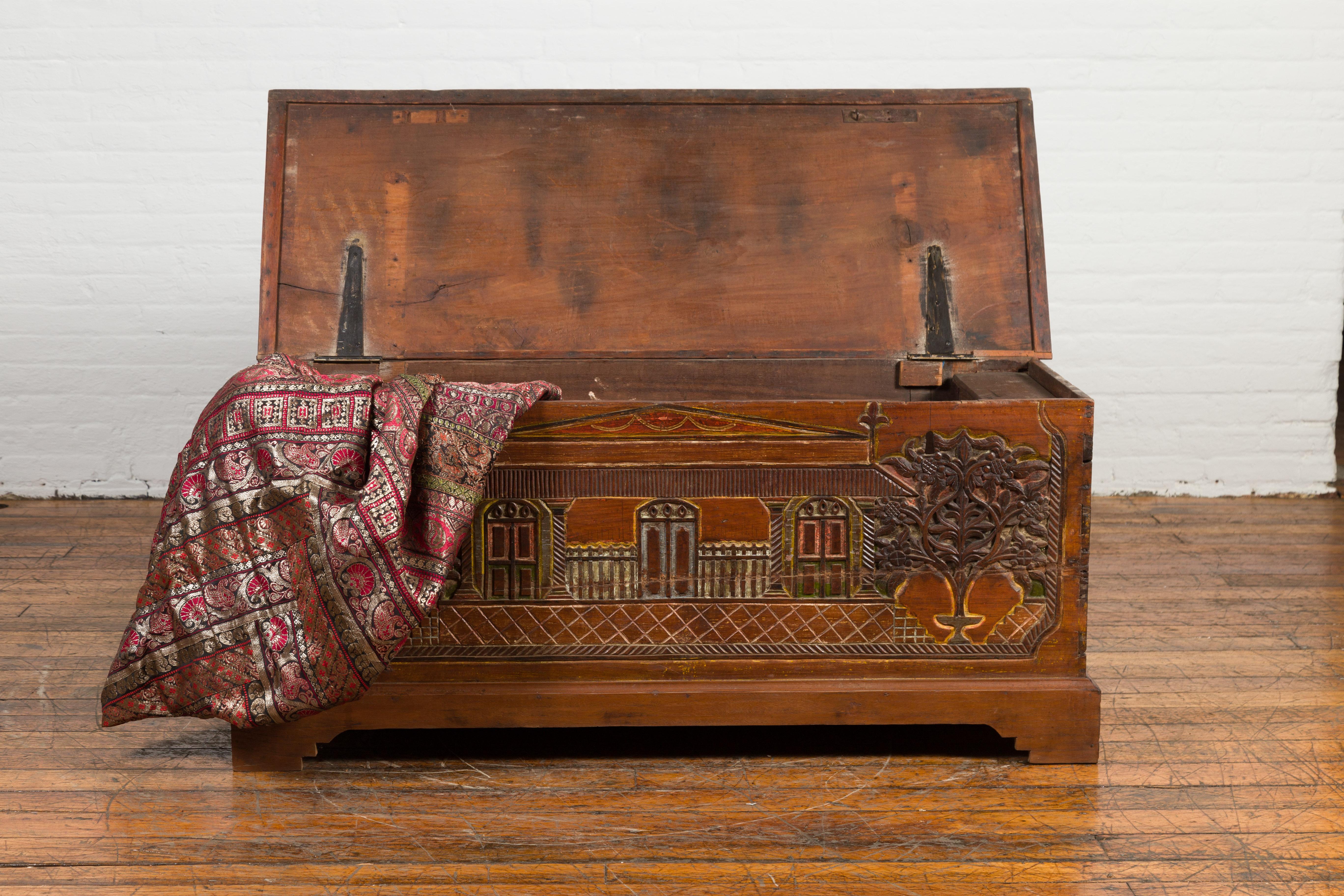 Wood Indonesian 19th Century Carved and Painted Trunk with Architecture and Foliage For Sale