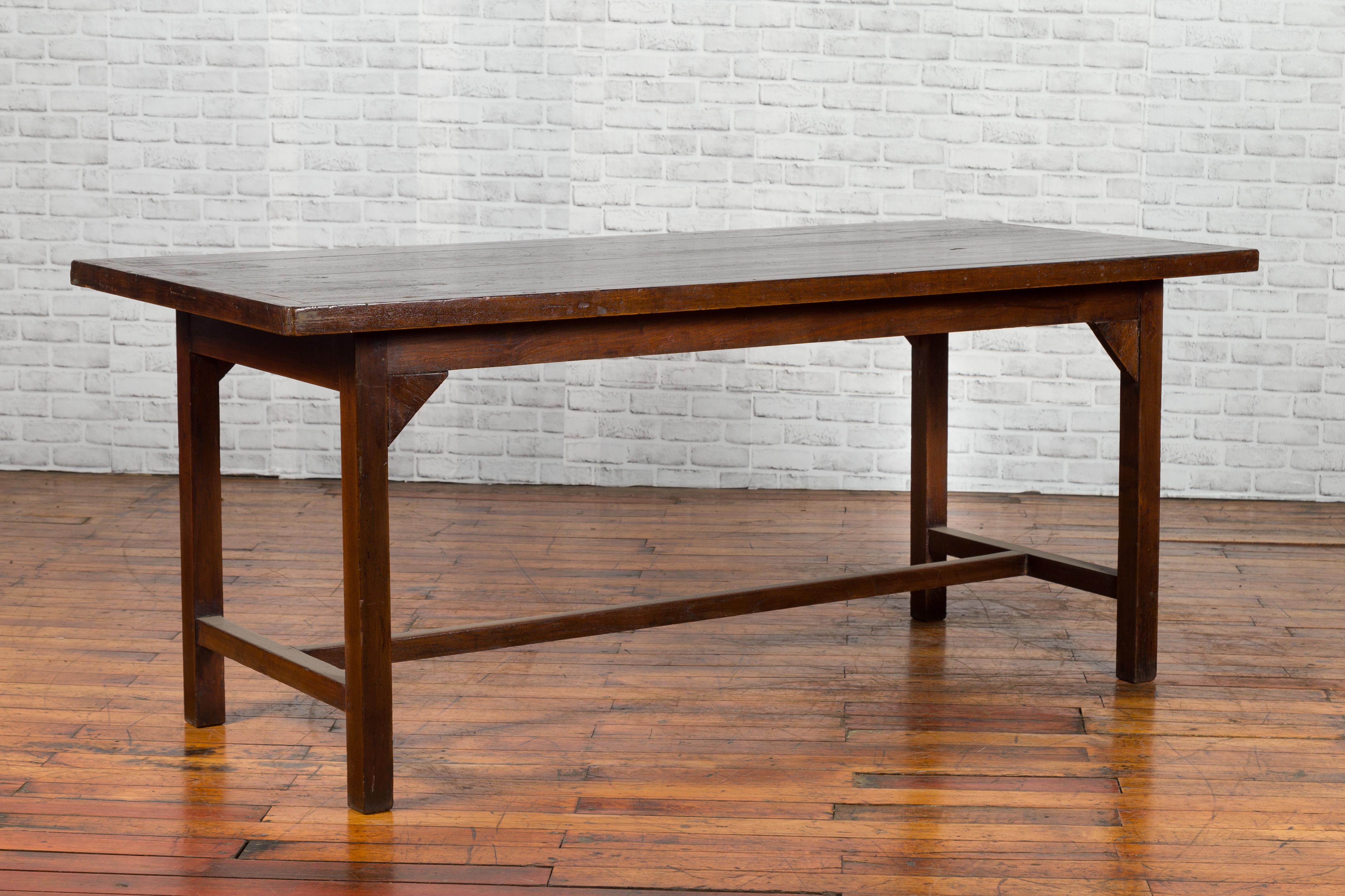 Indonesian 20th Century Table with Dark Brown Patina and H-Form Stretcher In Good Condition In Yonkers, NY