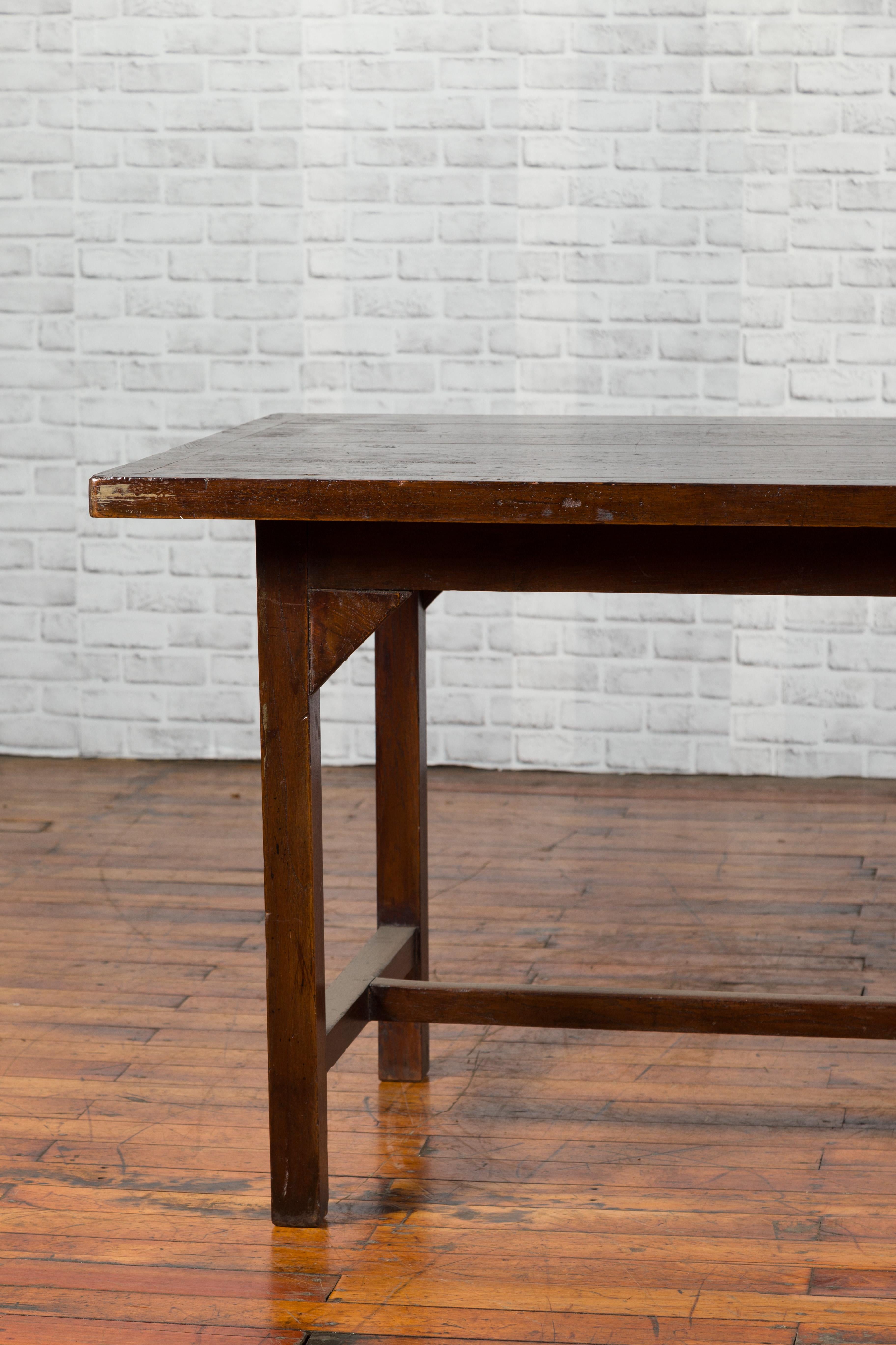 Indonesian 20th Century Table with Dark Brown Patina and H-Form Stretcher 1