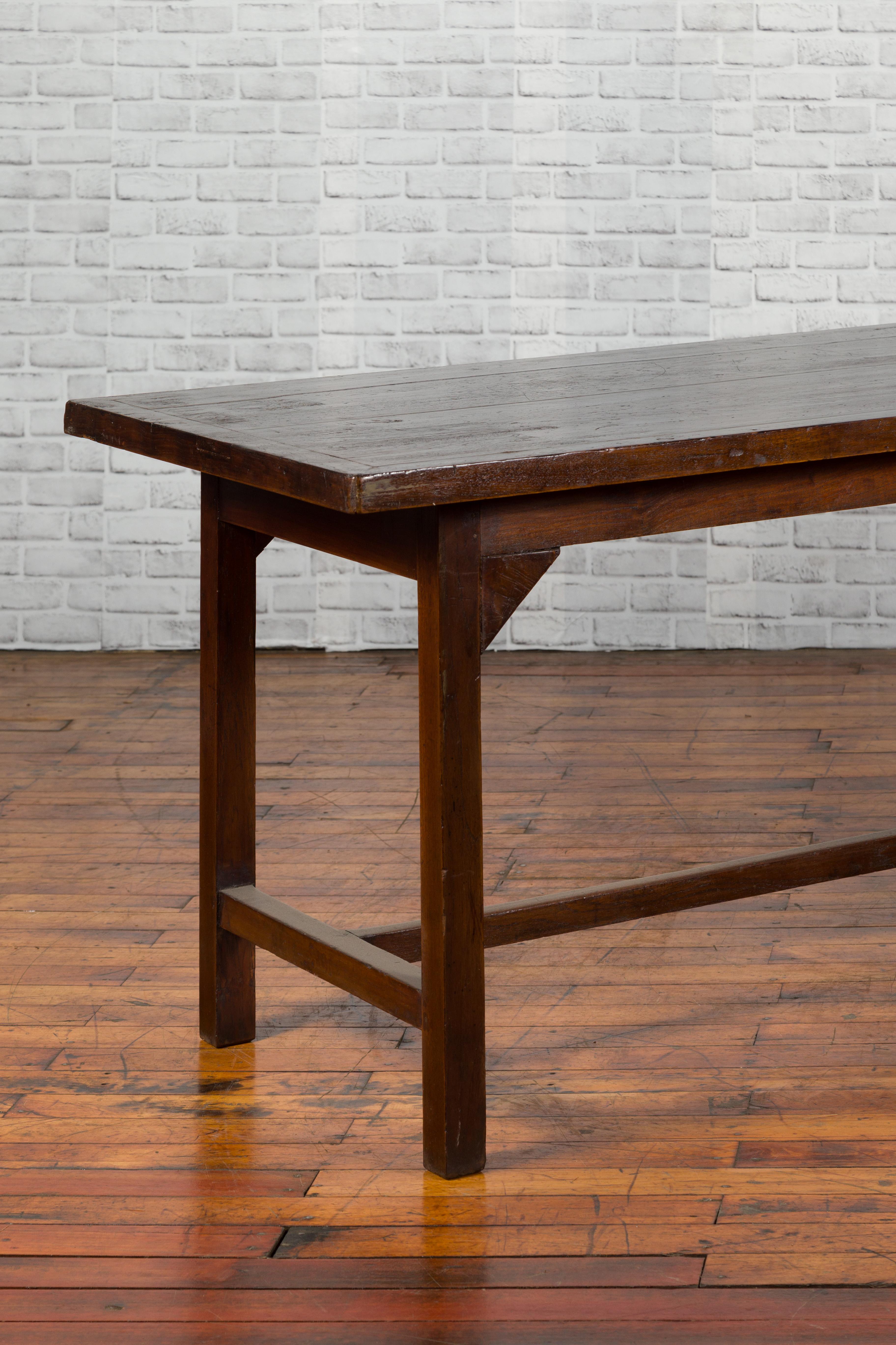 Indonesian 20th Century Table with Dark Brown Patina and H-Form Stretcher 4