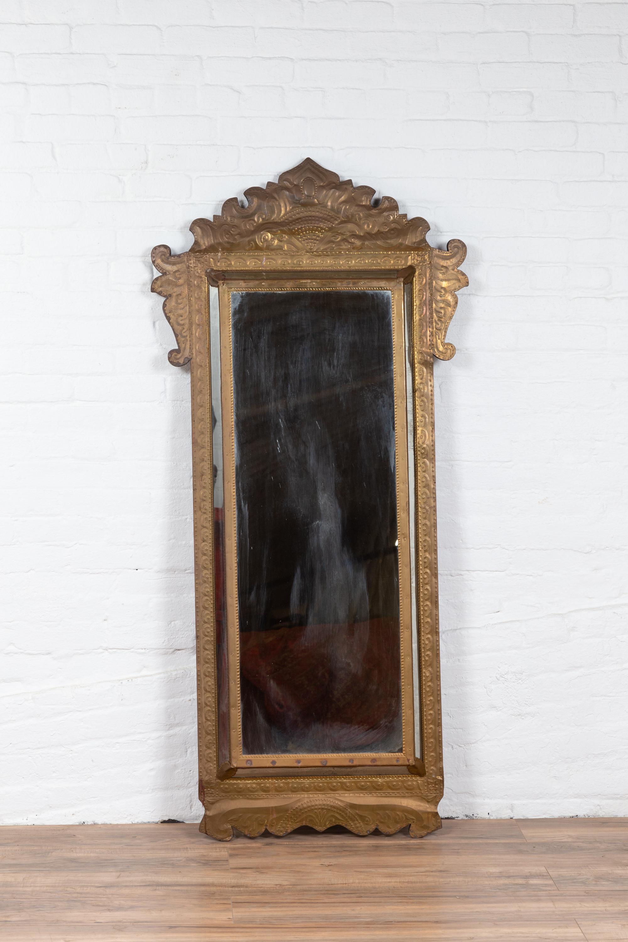 Indonesian Antique Repoussé Brass Pareclose Mirror with Flamboyant Crest In Good Condition In Yonkers, NY