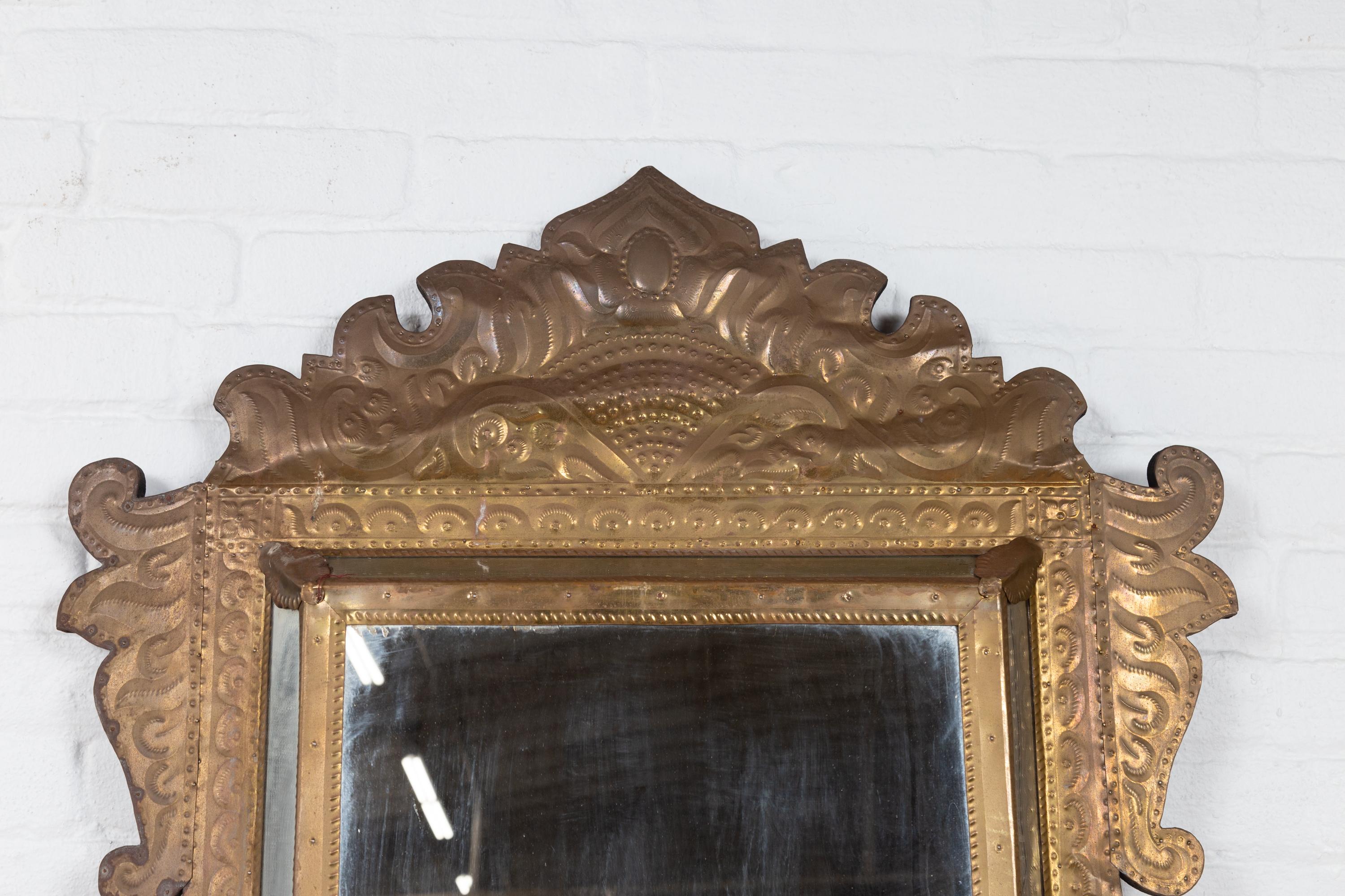 20th Century Indonesian Antique Repoussé Brass Pareclose Mirror with Flamboyant Crest