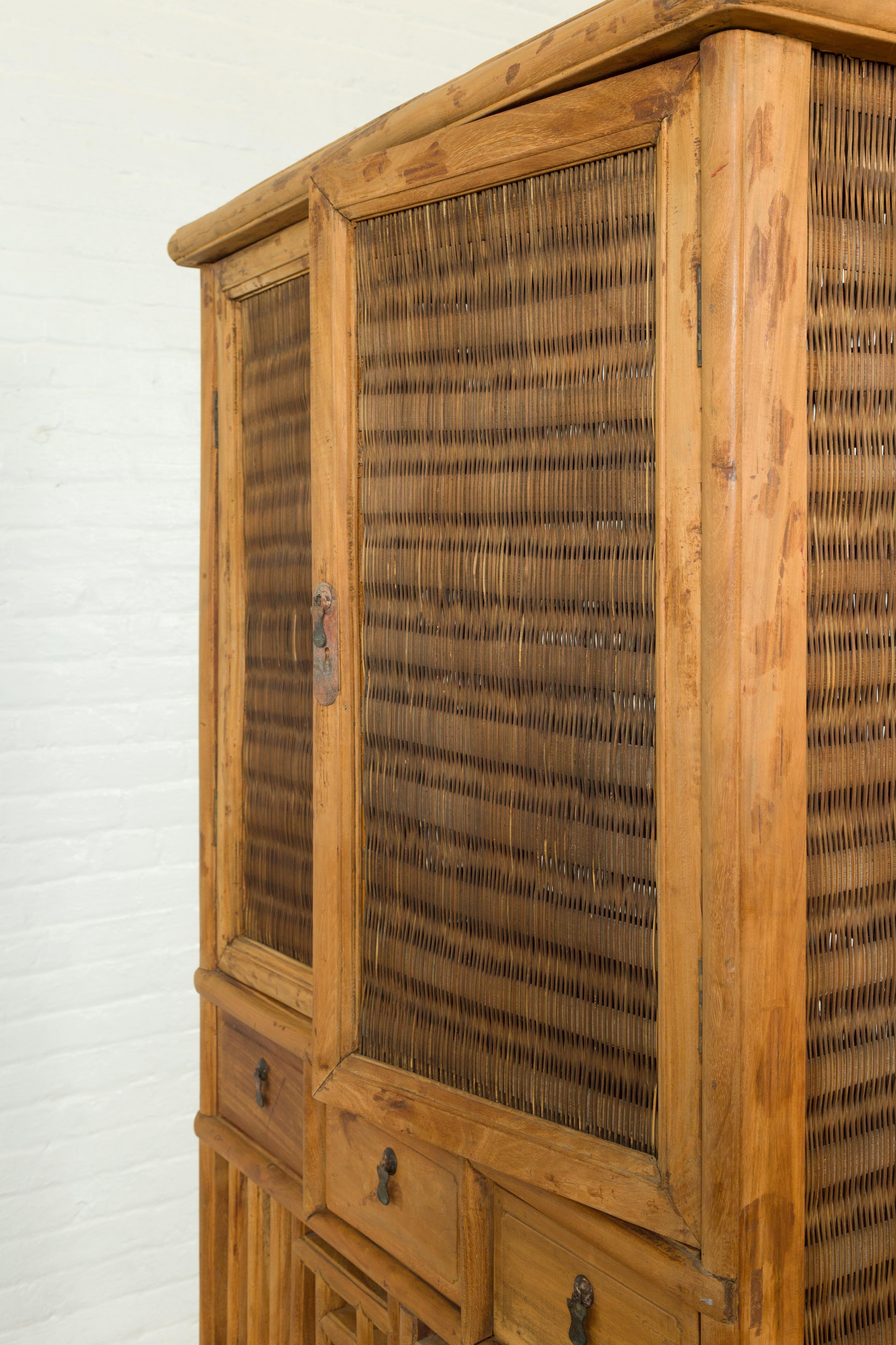 Indonesian Cabinet with Rattan Doors, Drawers and Fretwork Sliding Panels For Sale 3