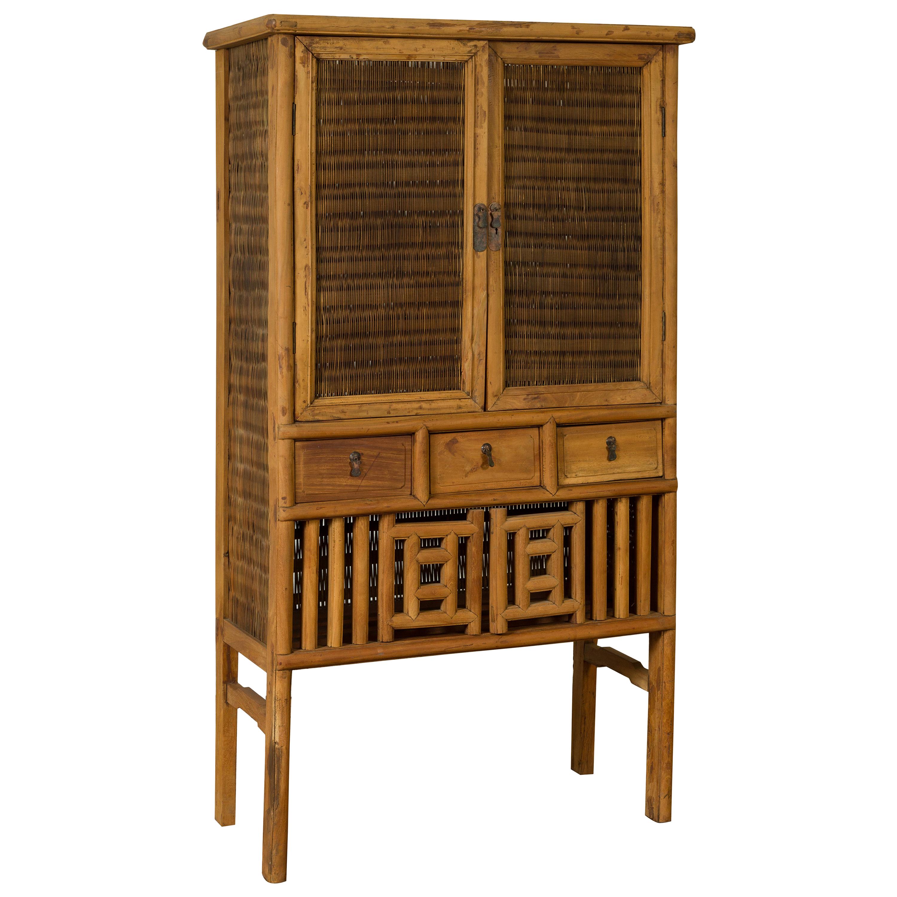 Indonesian Cabinet with Rattan Doors, Drawers and Fretwork Sliding Panels